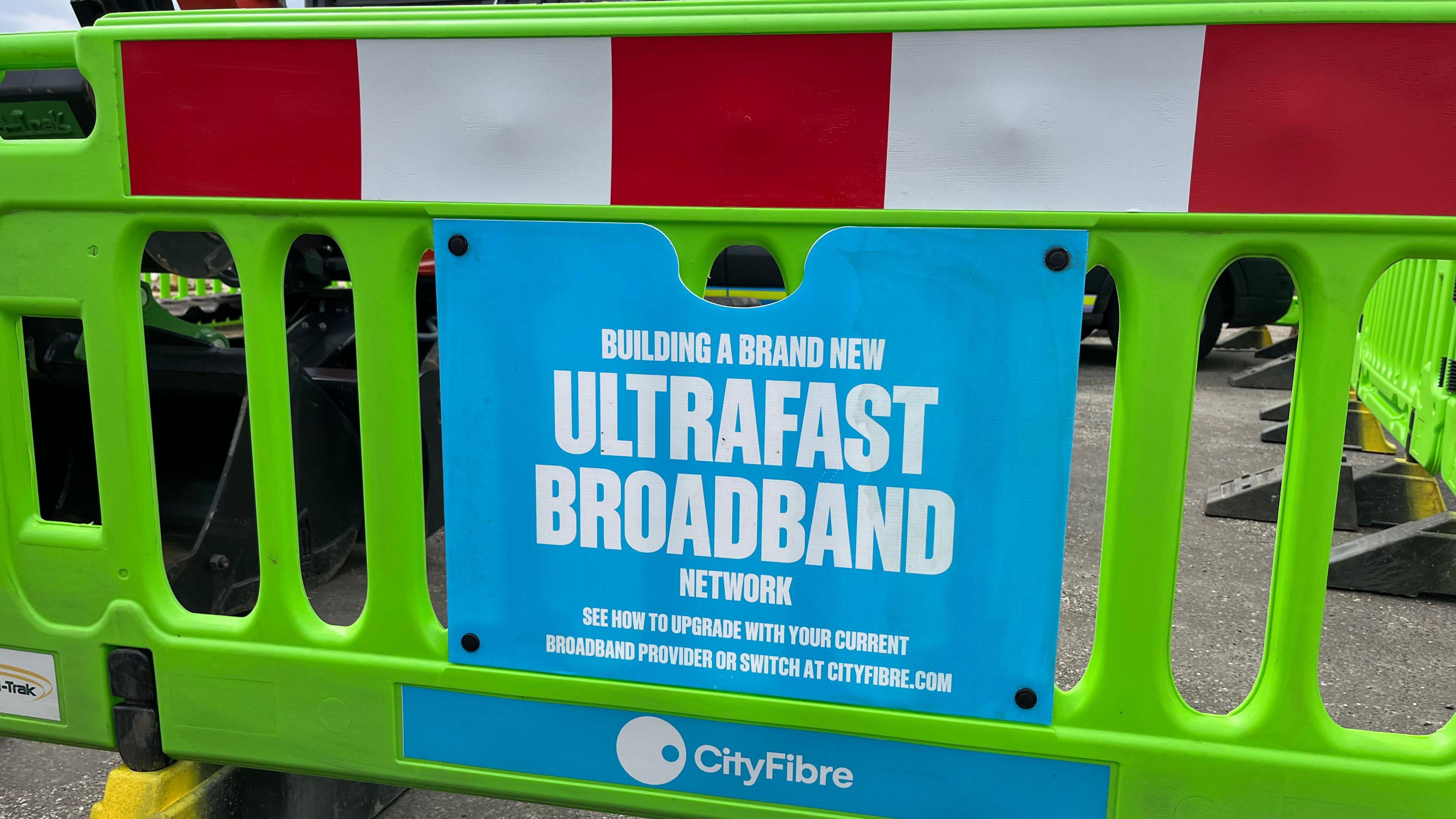 Worker's sign advertising ultrafast broadband  