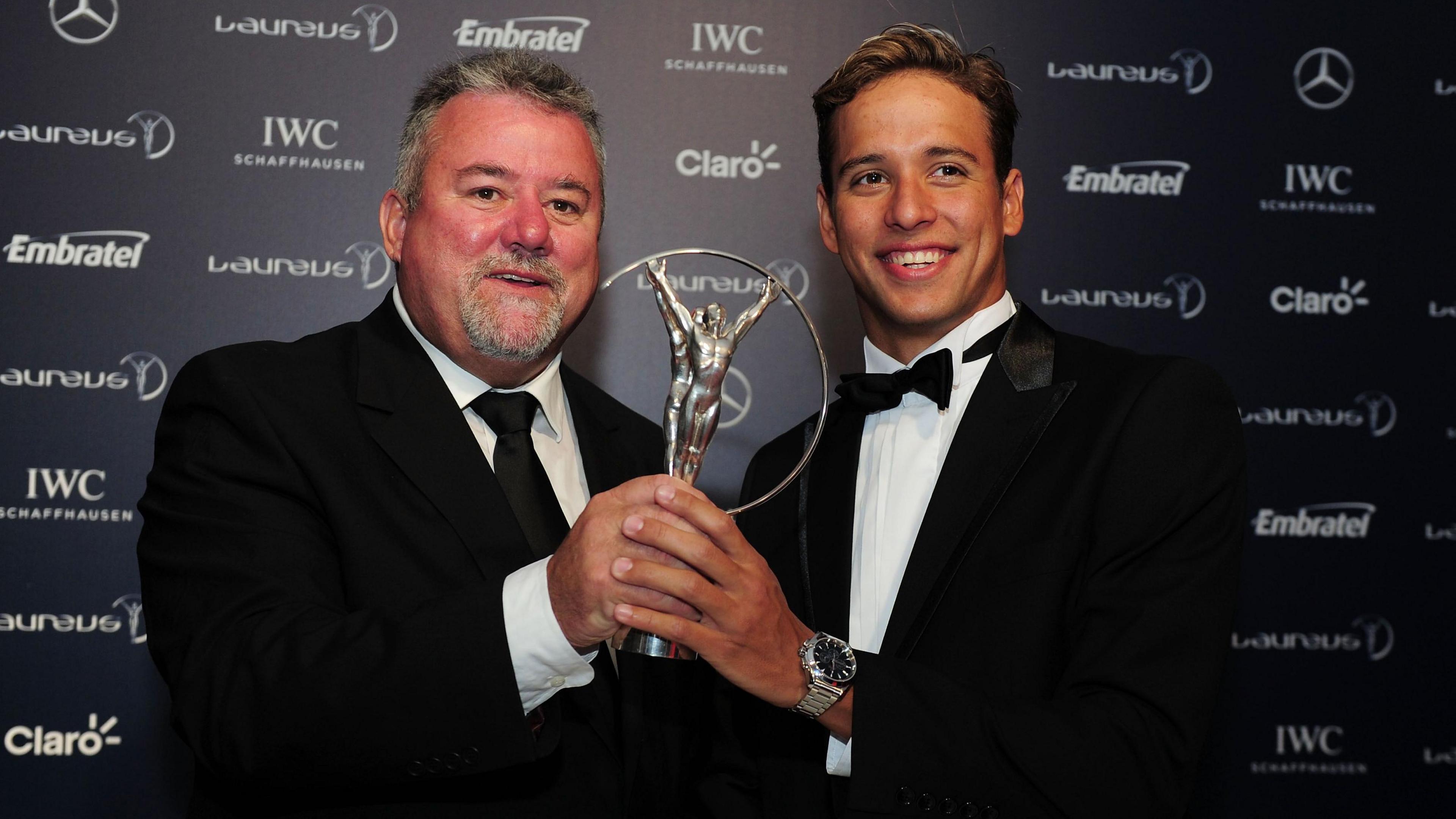 Bert and Chad pose with a 2013 Laureus World Sports Award in Rio