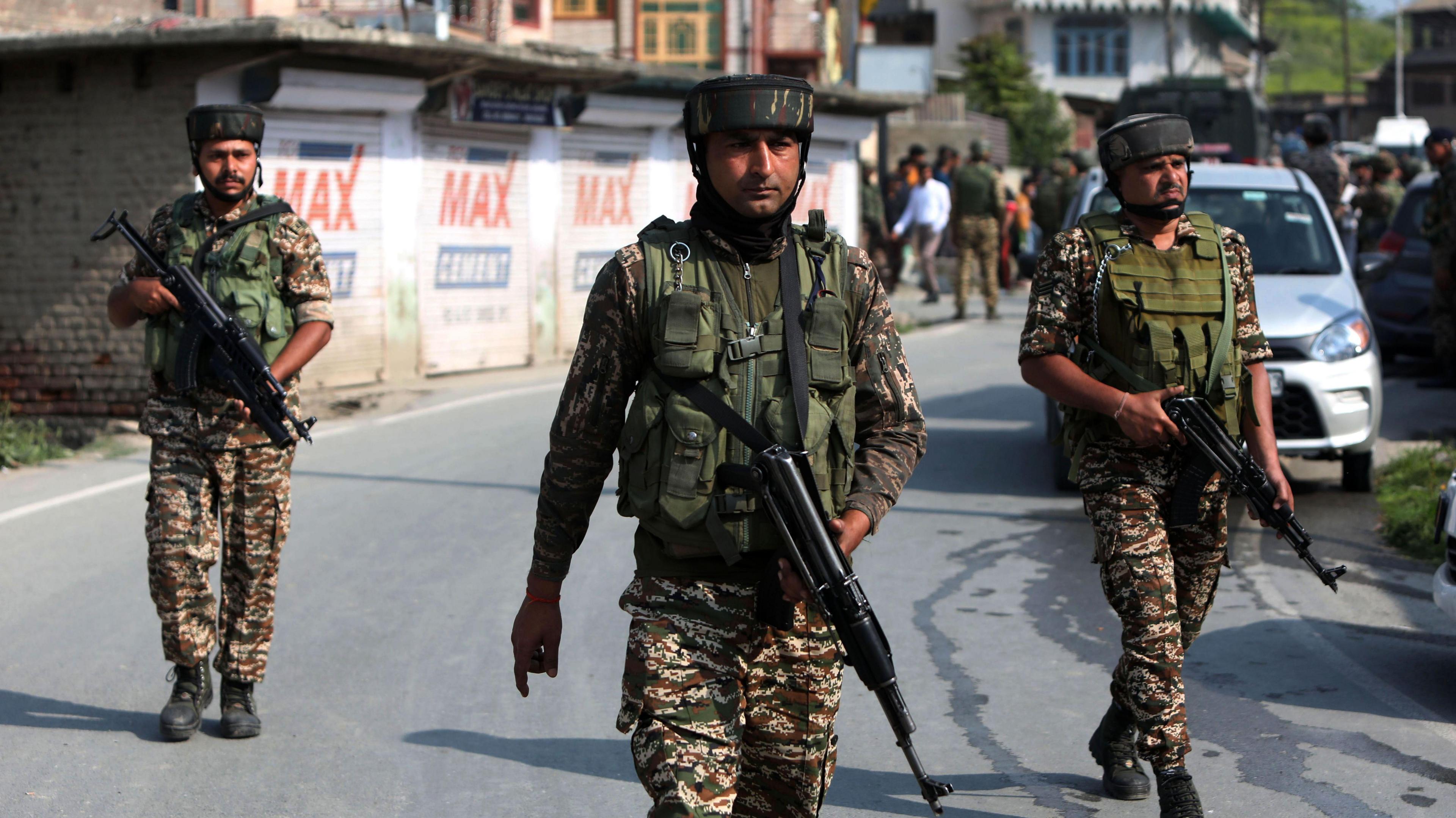 Indian soldiers patrol on foot in Kashmir