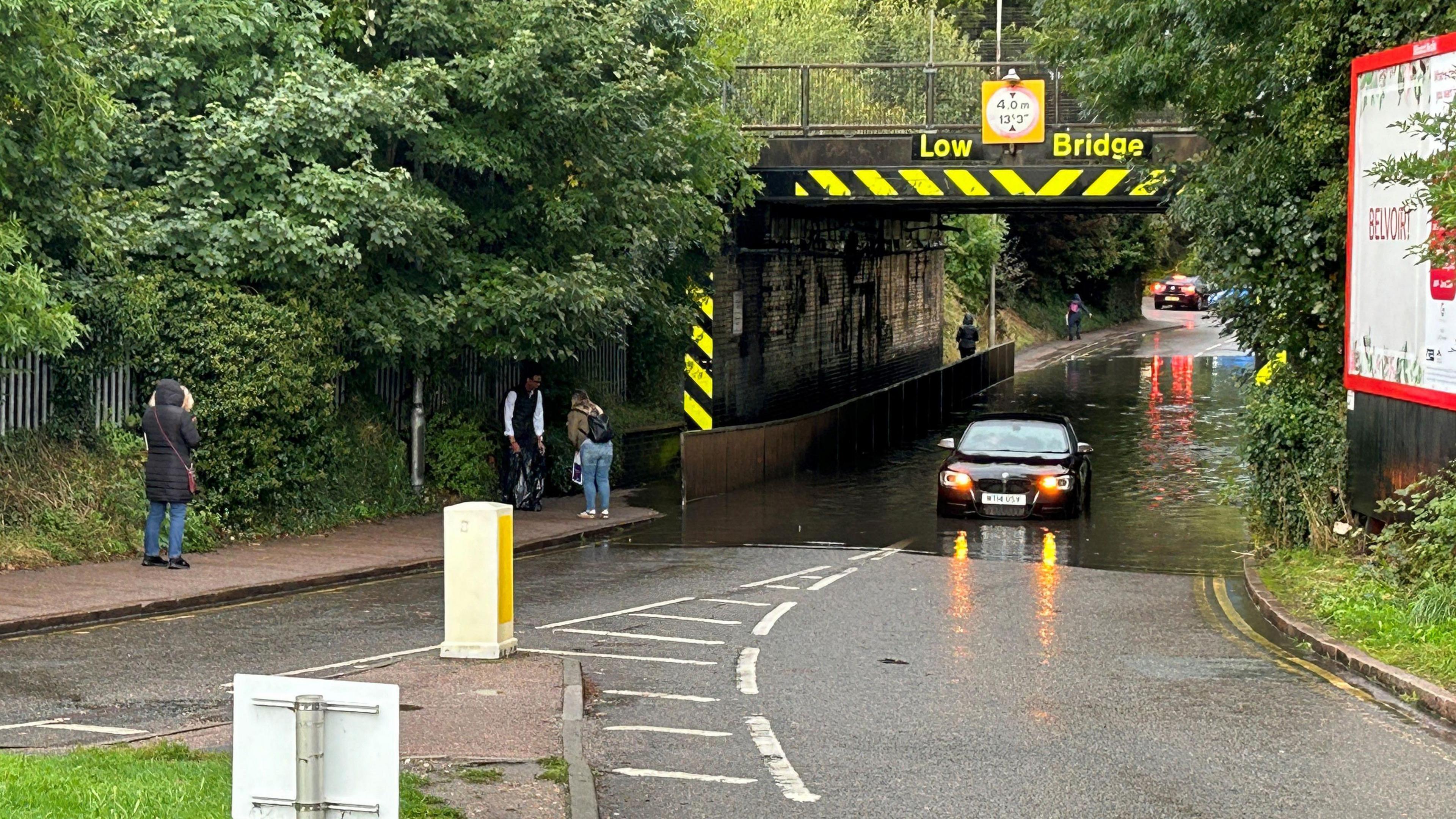 A stranded car in flood water on Cambridge Road, Hitchin