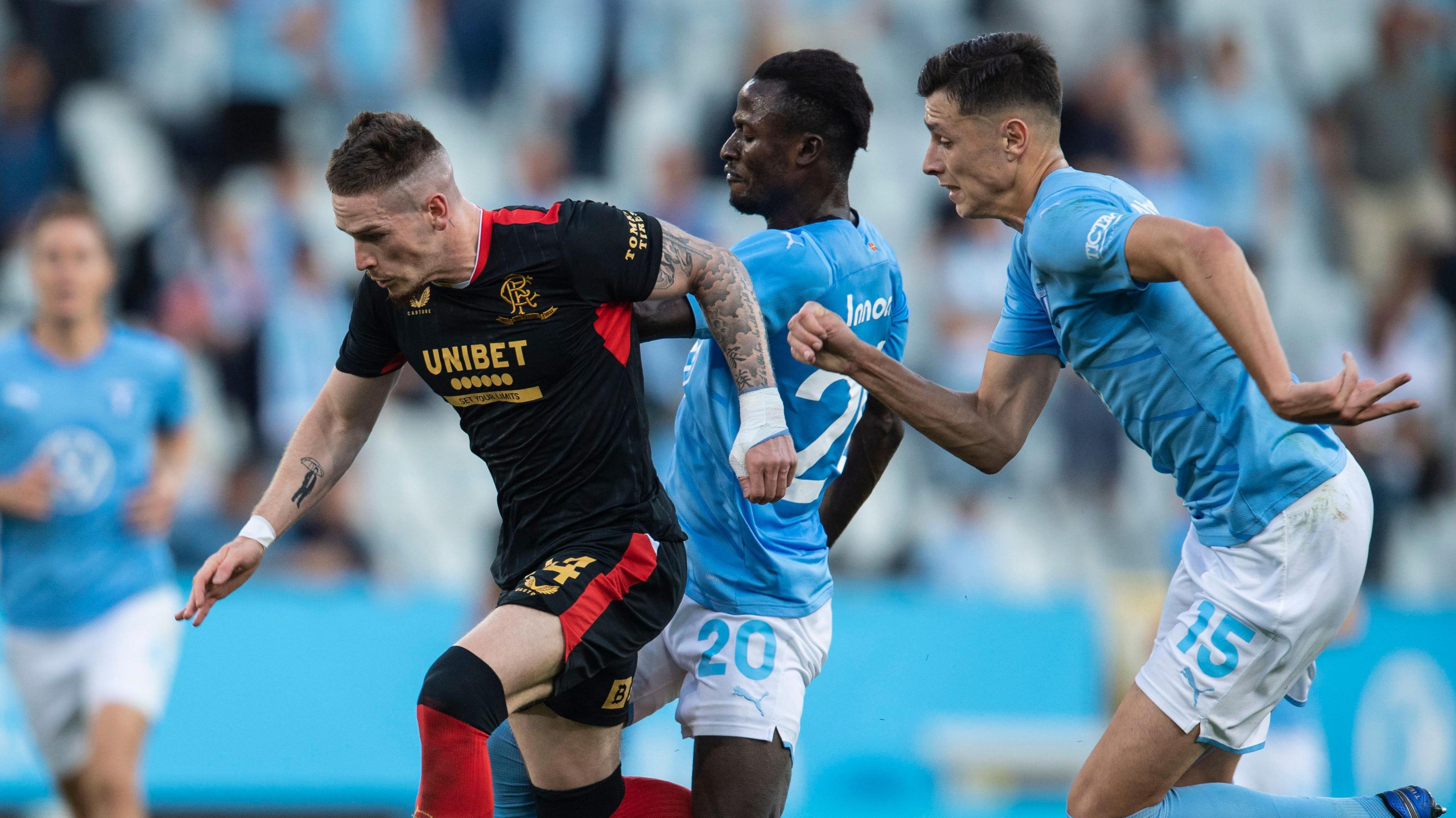 Rangers' Ryan Kent is challenged by Bonke Innocent during a Champions League qualifier between Malmo and Rangers at the Eleda Stadion