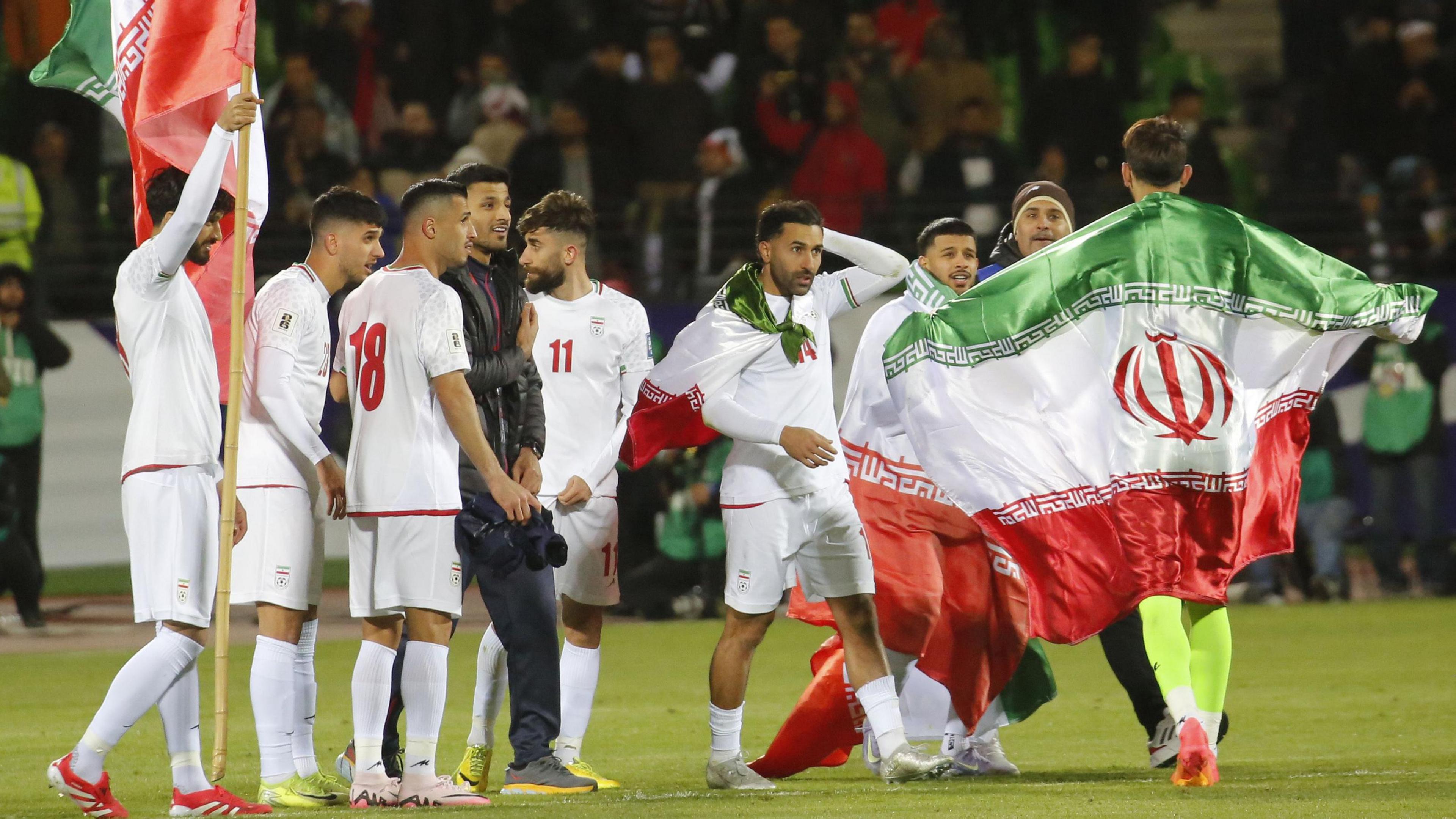 Iran celebrate qualifying for the 2026 World Cup after a draw with Uzbekistan in March 