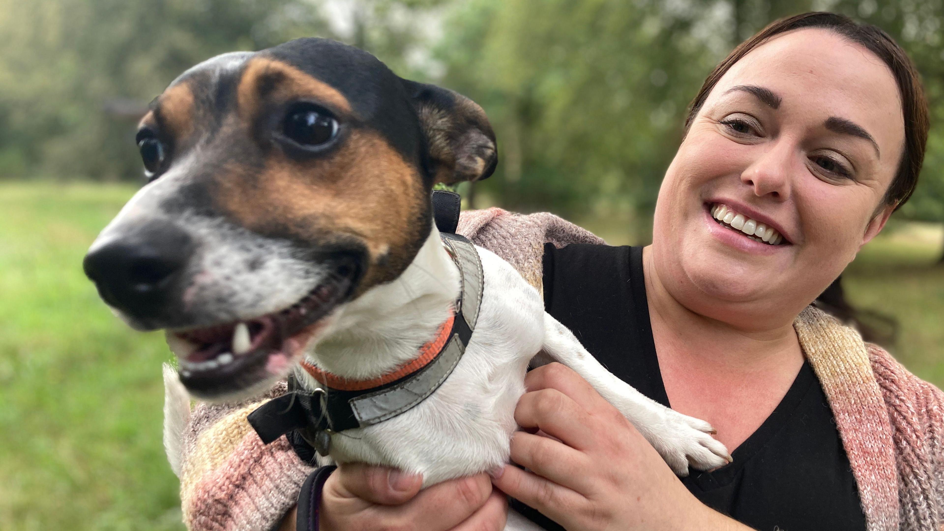 Katrina Dennis holding her Jack Russell called Dexter.