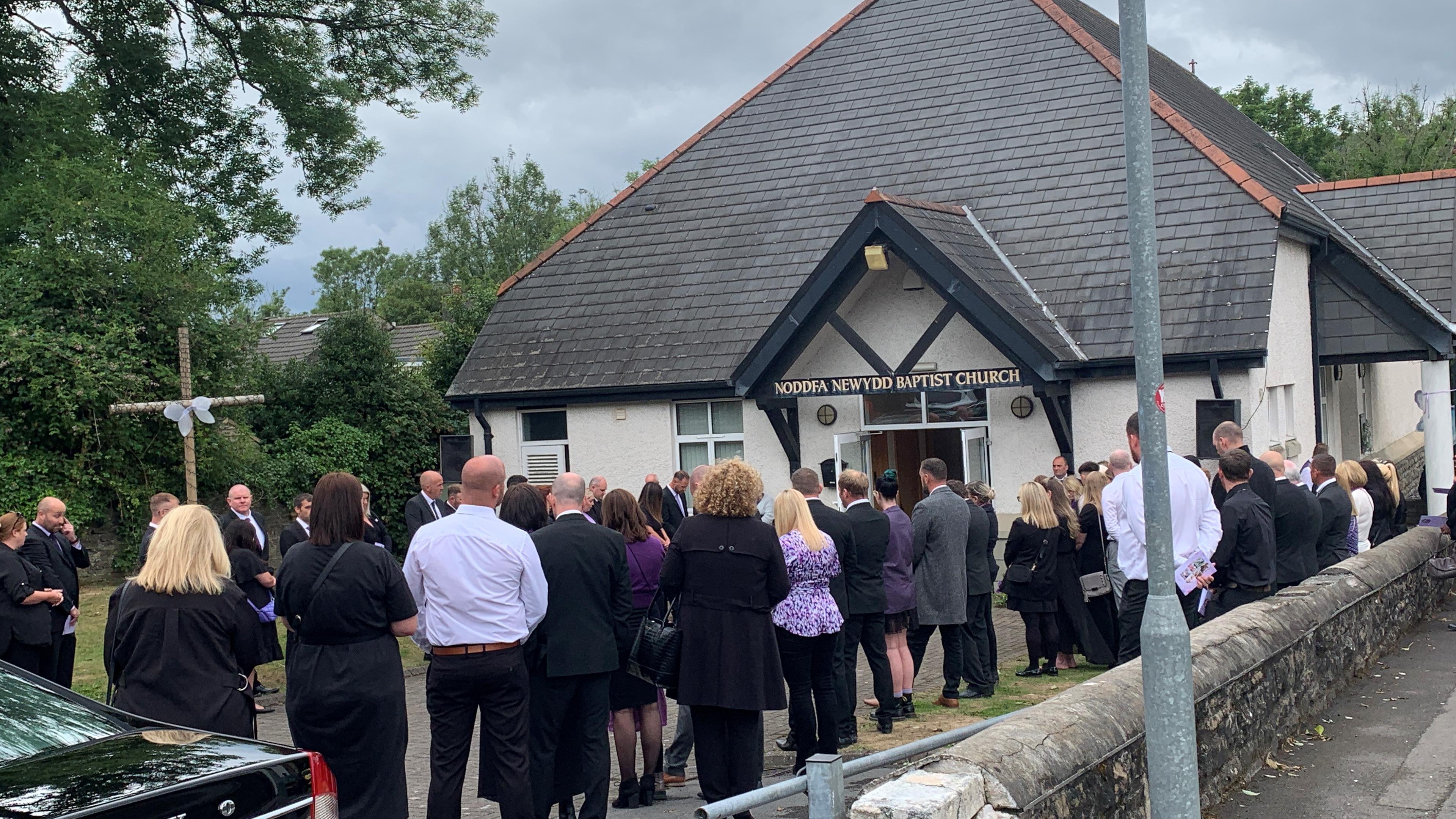 Mourners outside church