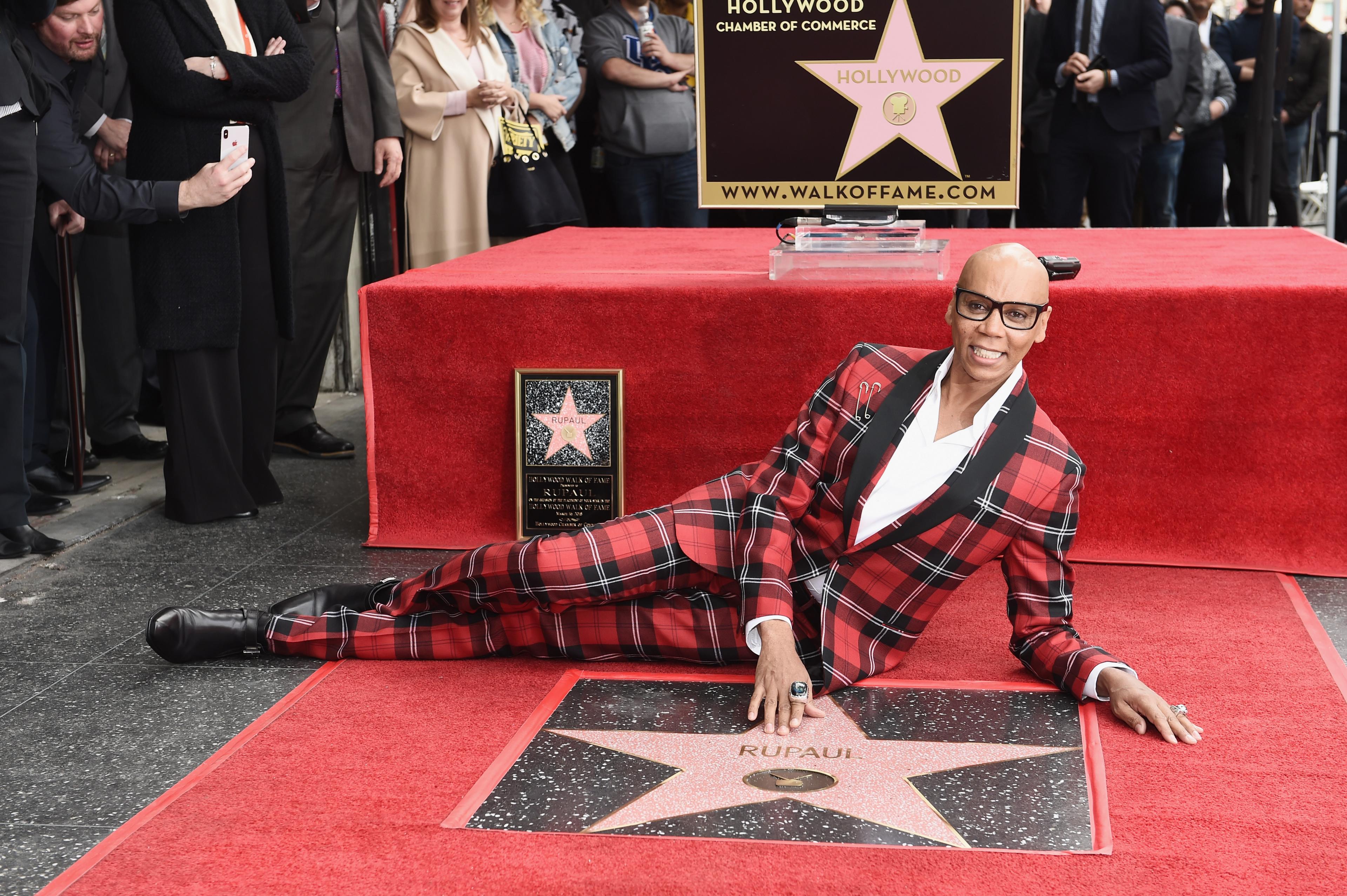 RuPaul poses with his star