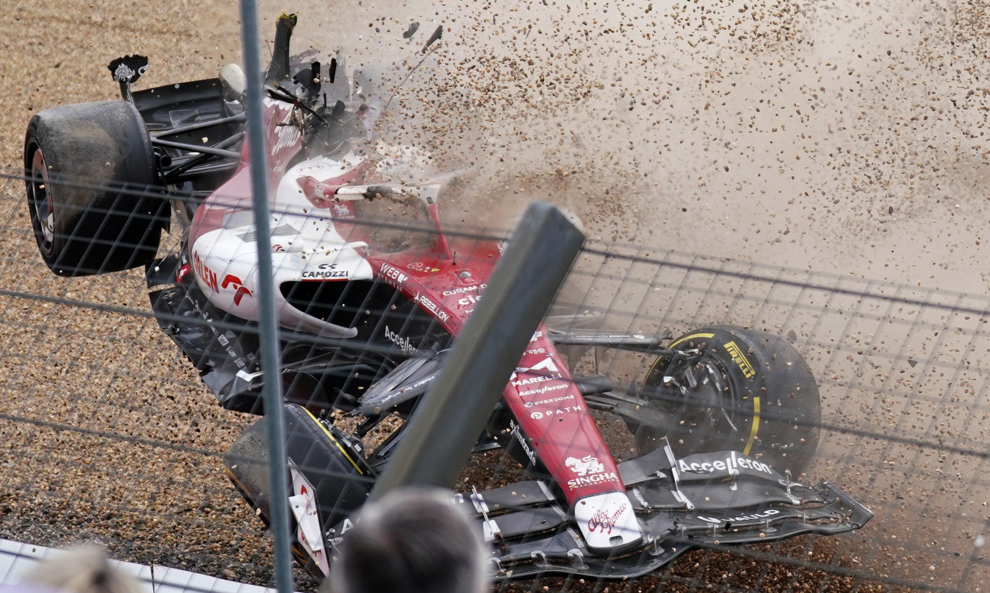 F1 car crashes nose first into a metal wired barrier protecting crowds