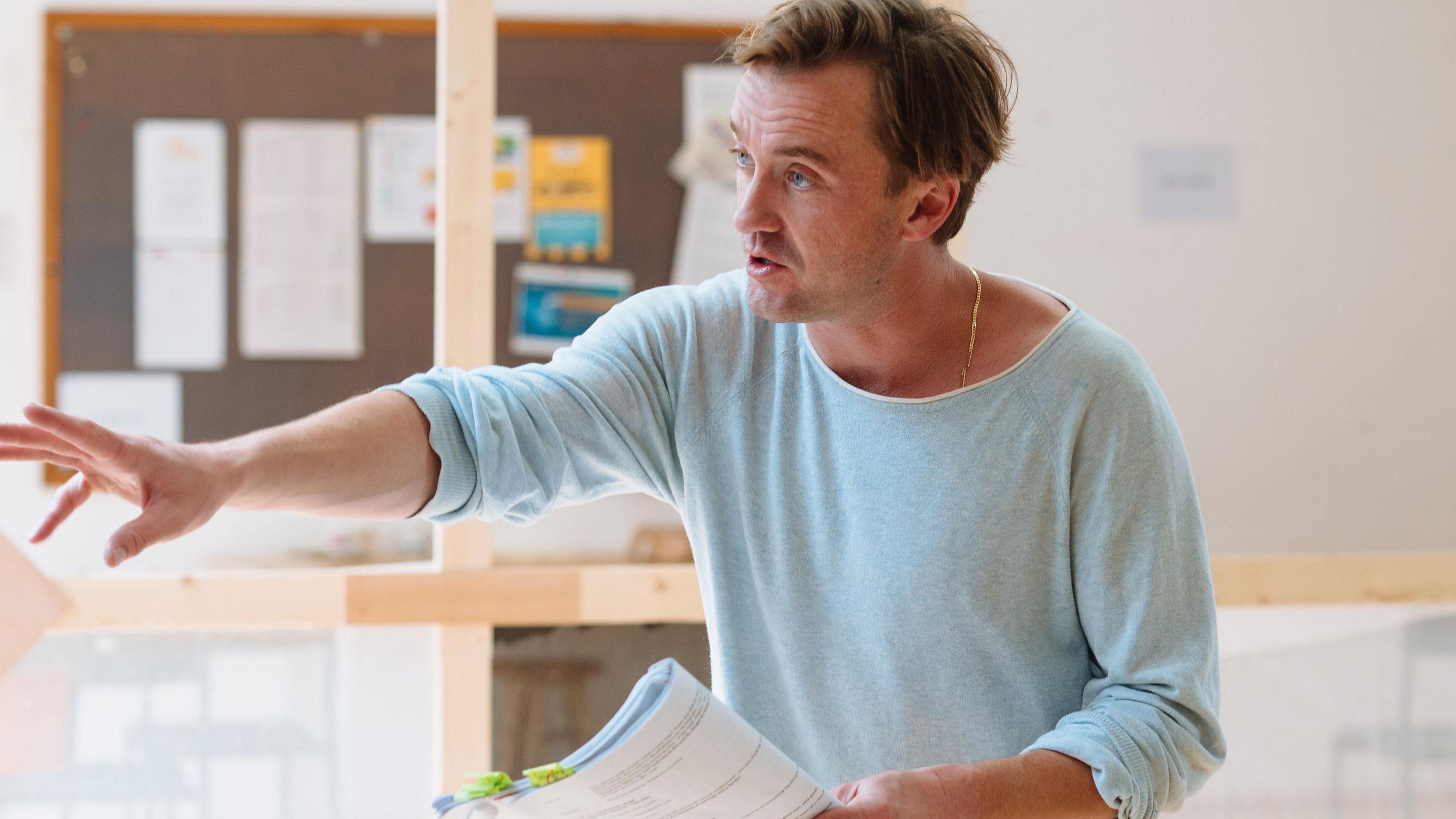 Tom Felton holding script during rehearsal of A Child of Science