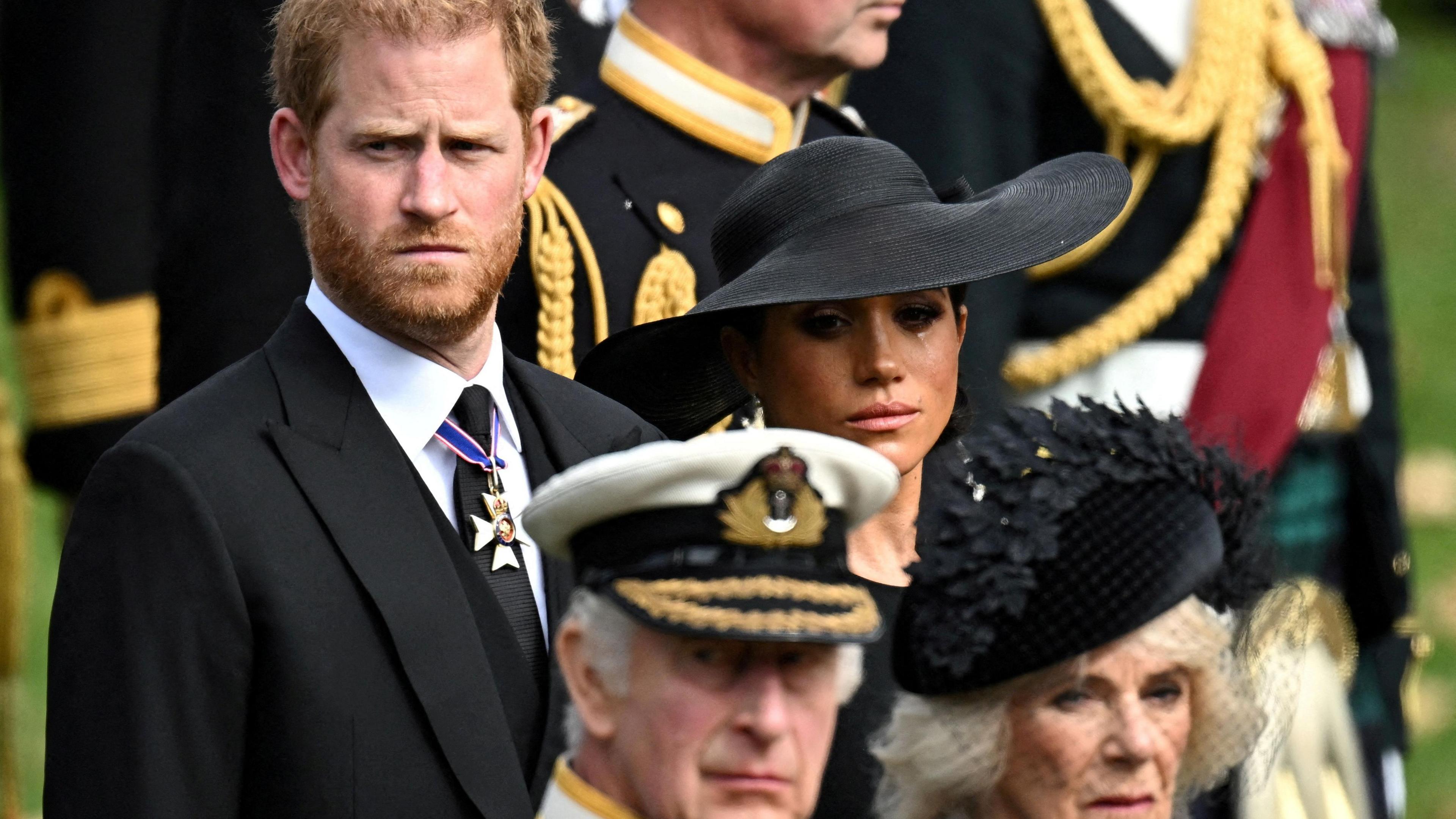  Duchess of Sussex, reacts as she, Prince Harry, Duke of Sussex, Queen Camilla and King Charles attend the state funeral and burial of Britain's Queen Elizabeth, in London, Britain, September 19, 2022