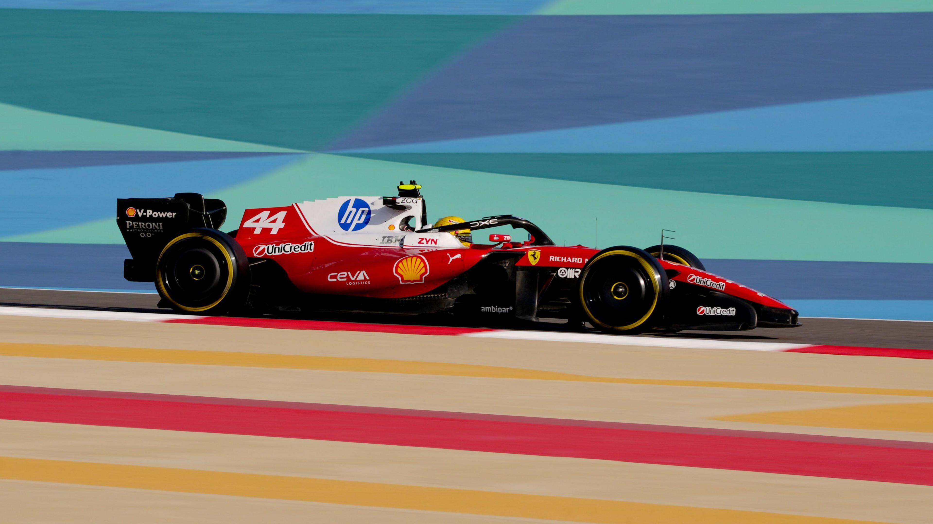 Lewis Hamilton drives the new Ferrari on track in Bahrain 
