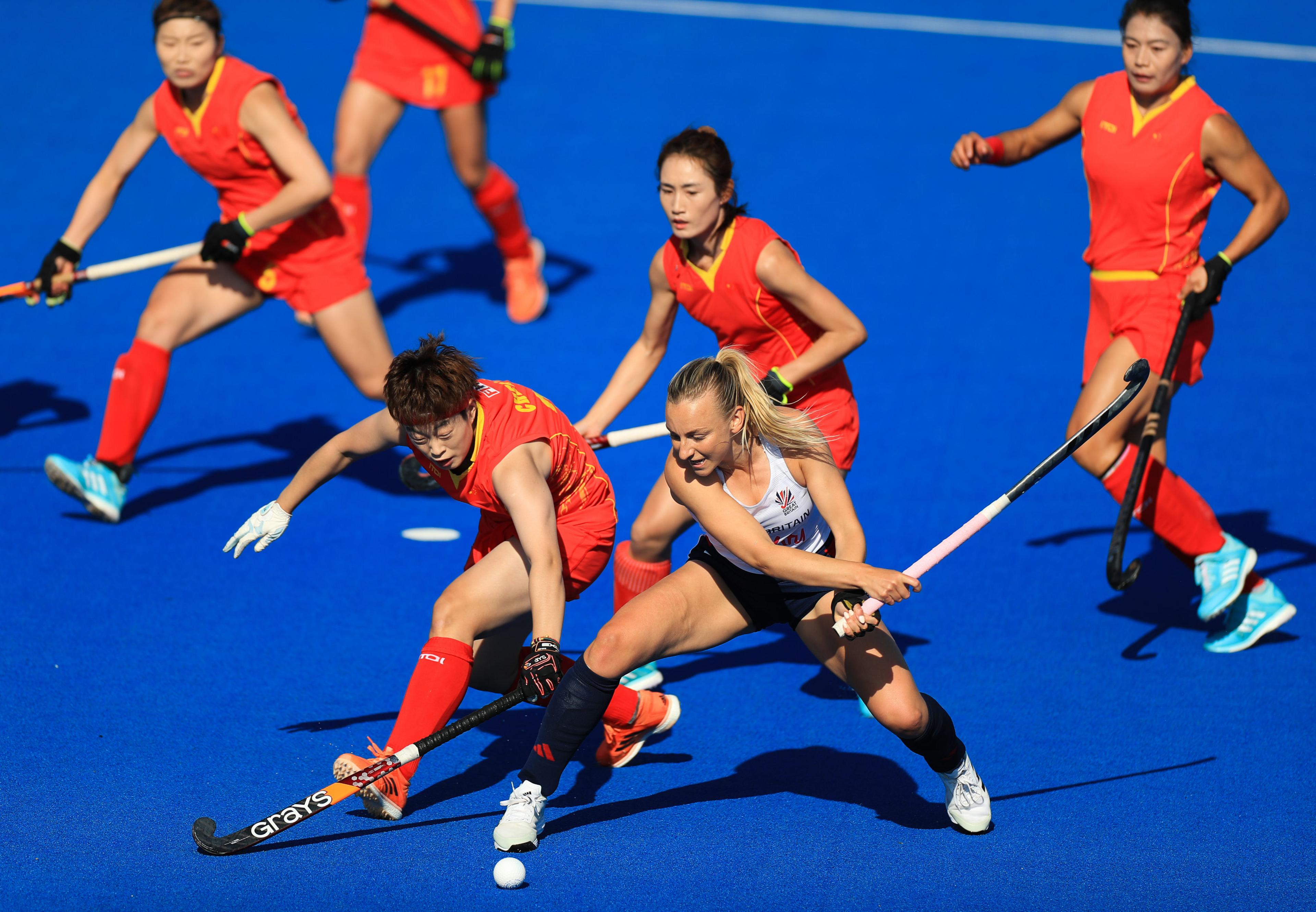 Hannah Martin (centre right) battles for the ball