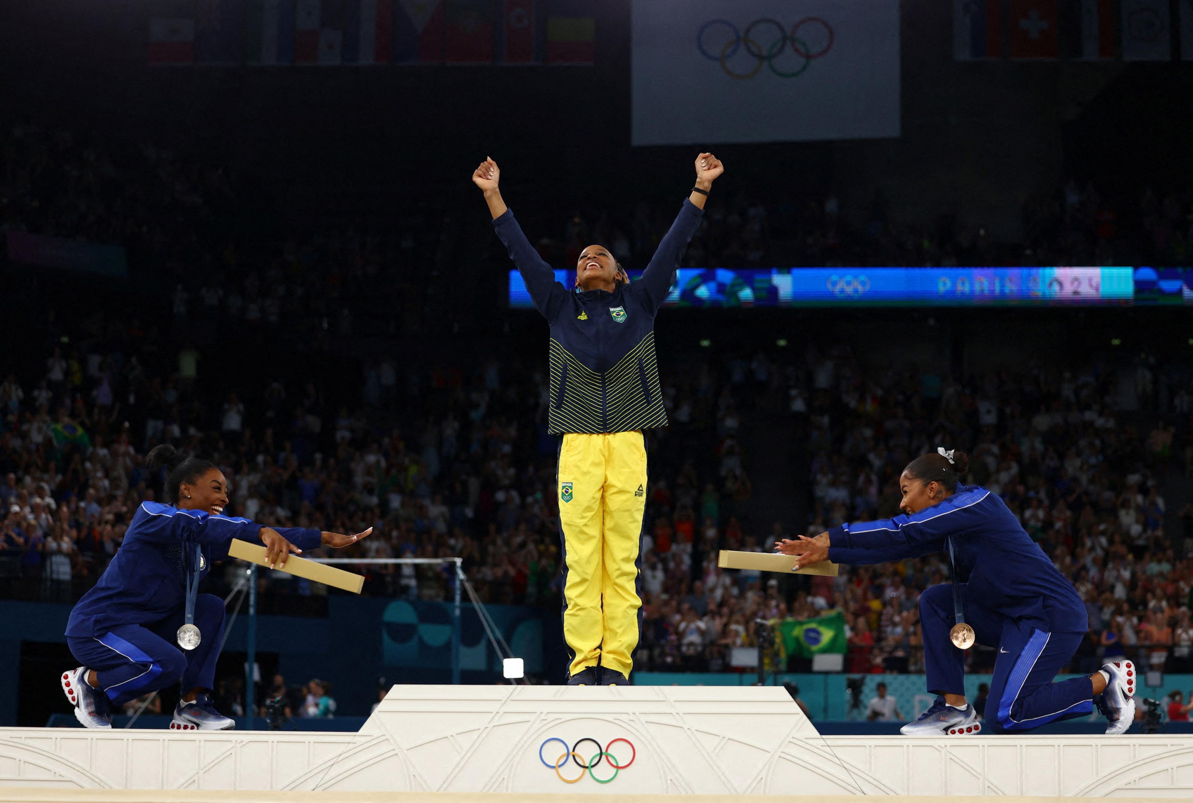 biles and chiles bowing to Andrade.