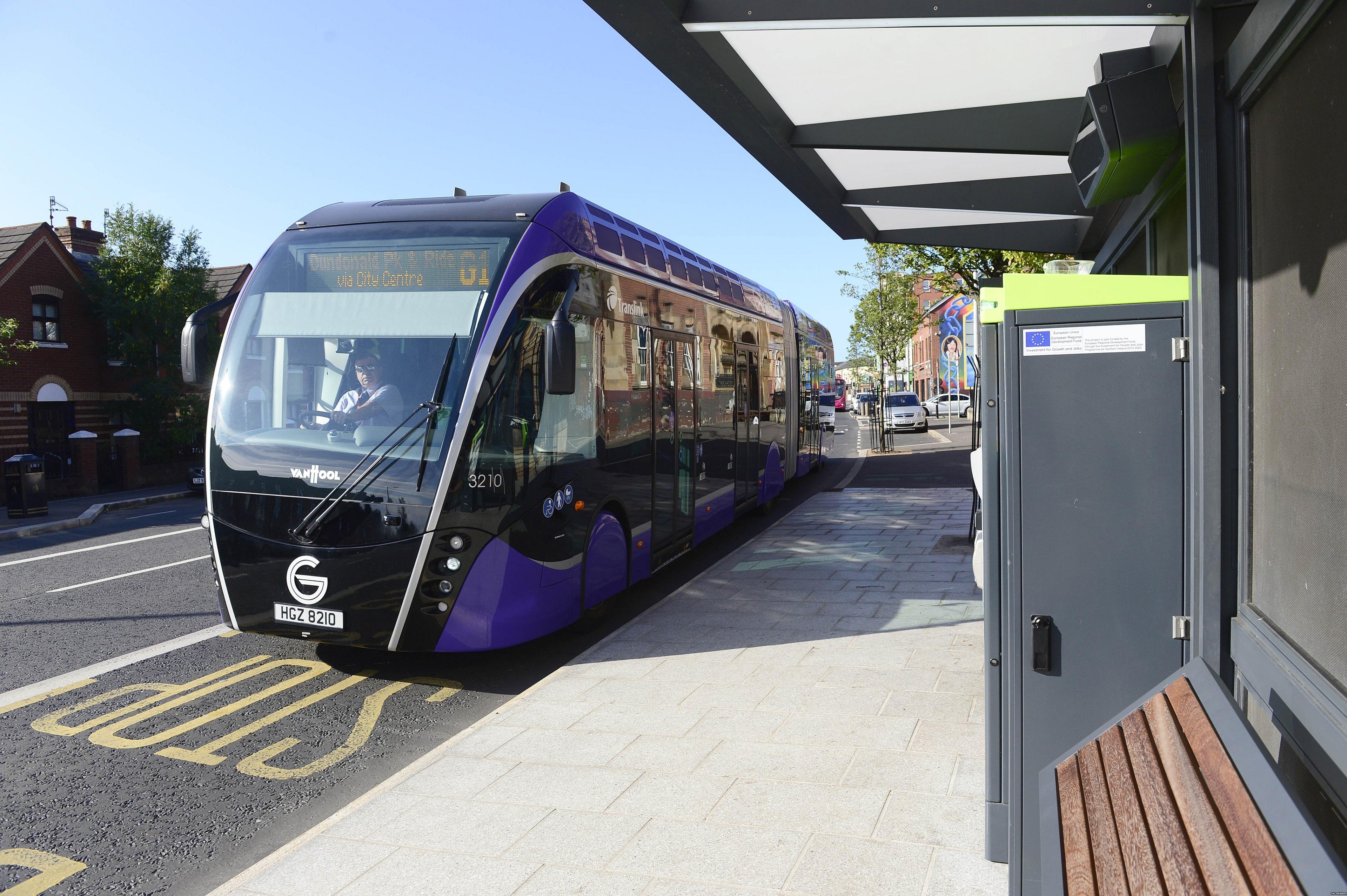 A Glider bus pulls into a stop beside a ticket machine (file photo)