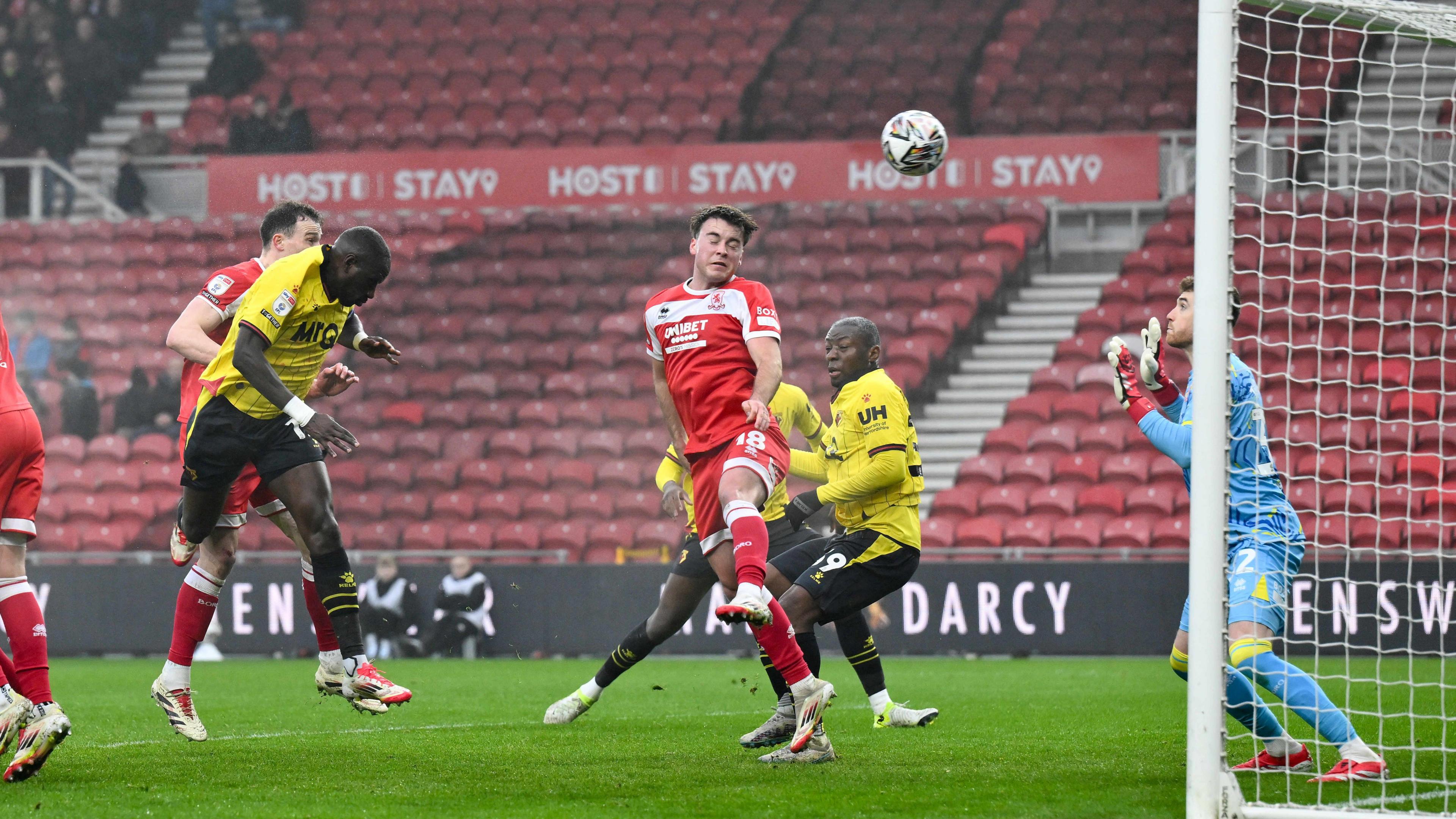 Watford player Moussa Sissoko (left) heads the ball into the Middlesbrough net