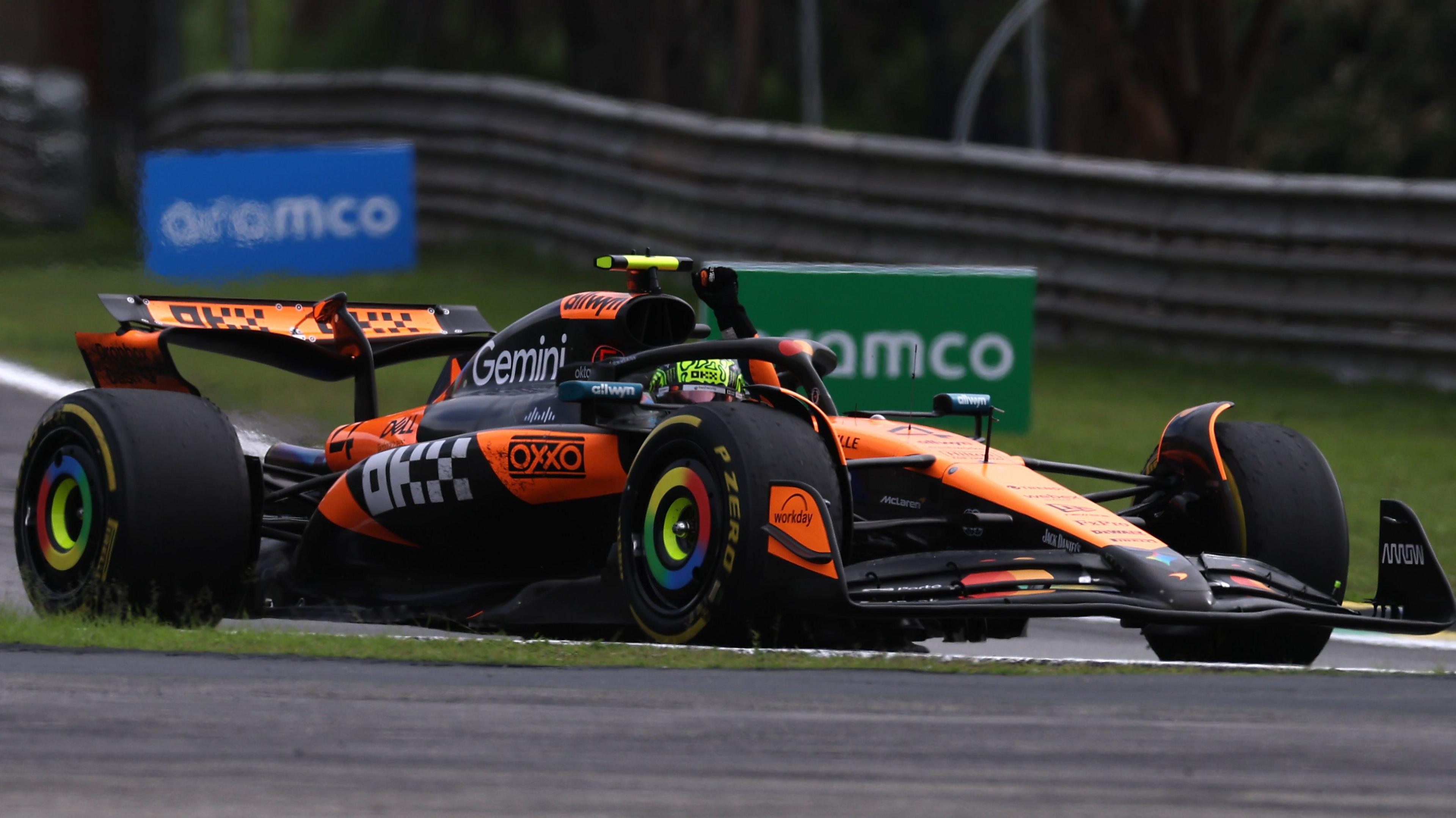 McLaren's Lando Norris waves from his car after winning the Sao Paulo Grand Prix