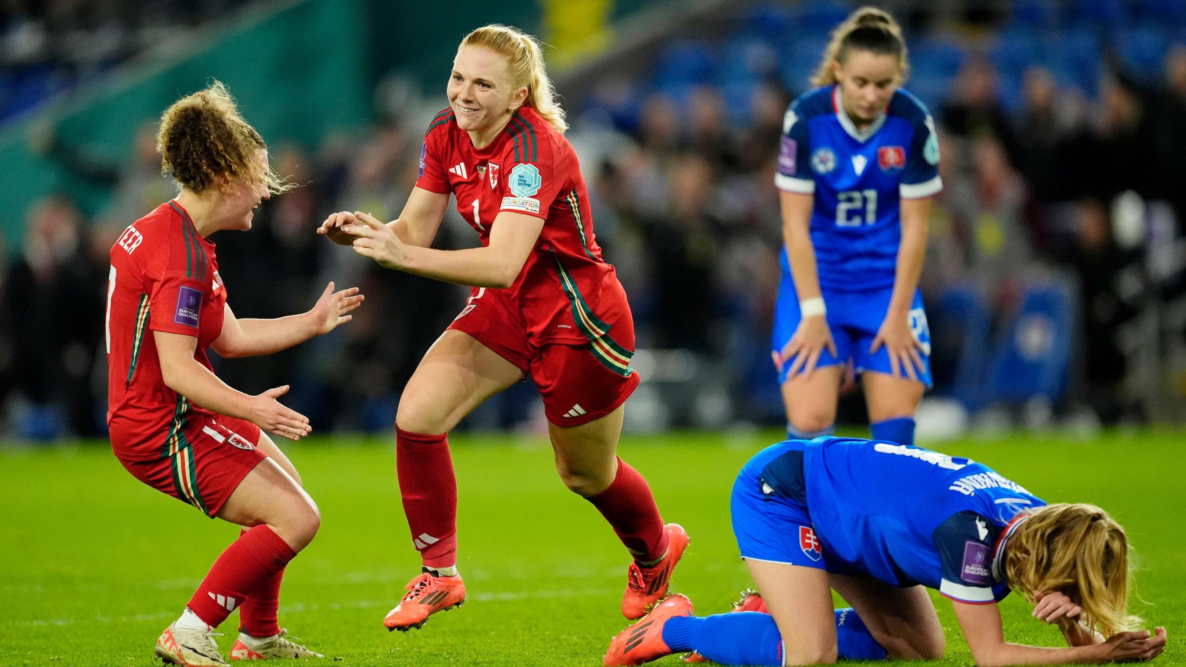 Ceri Holland's late winner booked Wales a play-off final against the Republic of Ireland