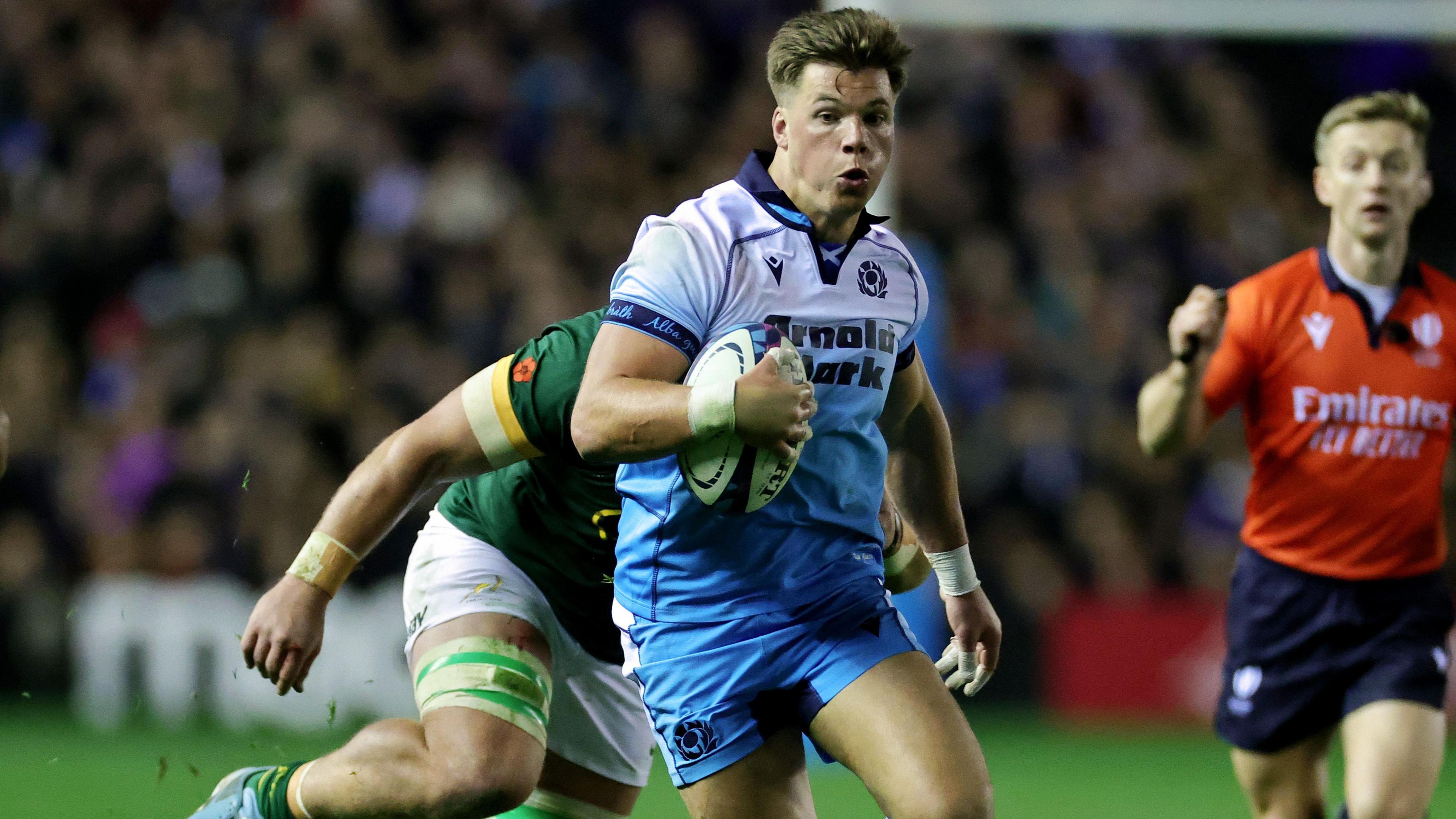 Huw Jones makes a break for Scotland