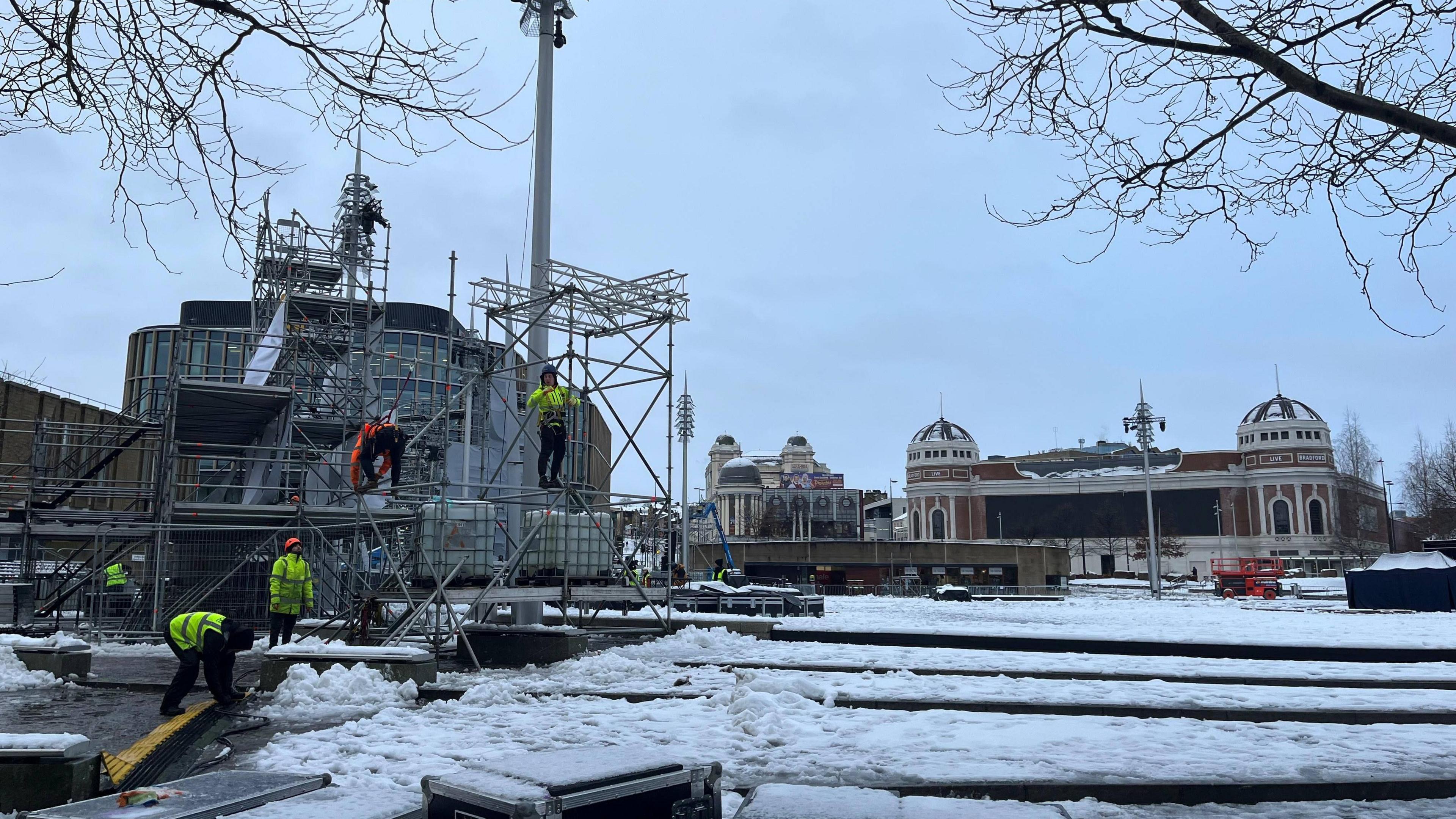 Workers setting up stage in Bradford city centre