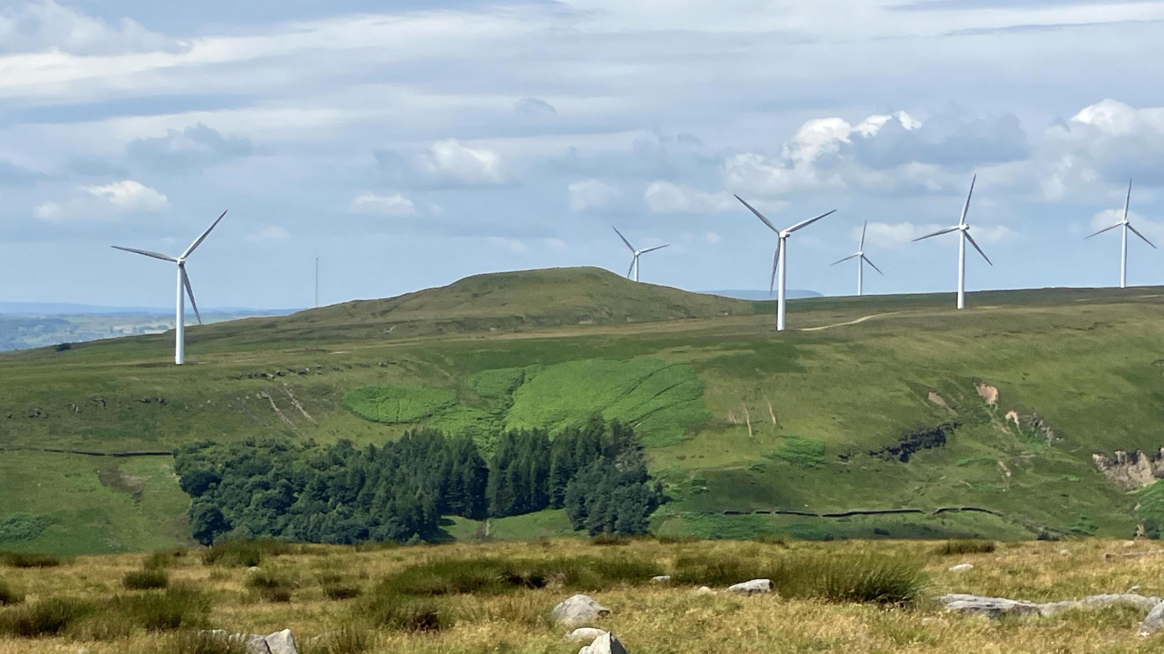 Photograph of turbines at the Scout Moor wind farm. The picture is taken from the Cotton Famine Road on the hills above Norden in Rochdale.