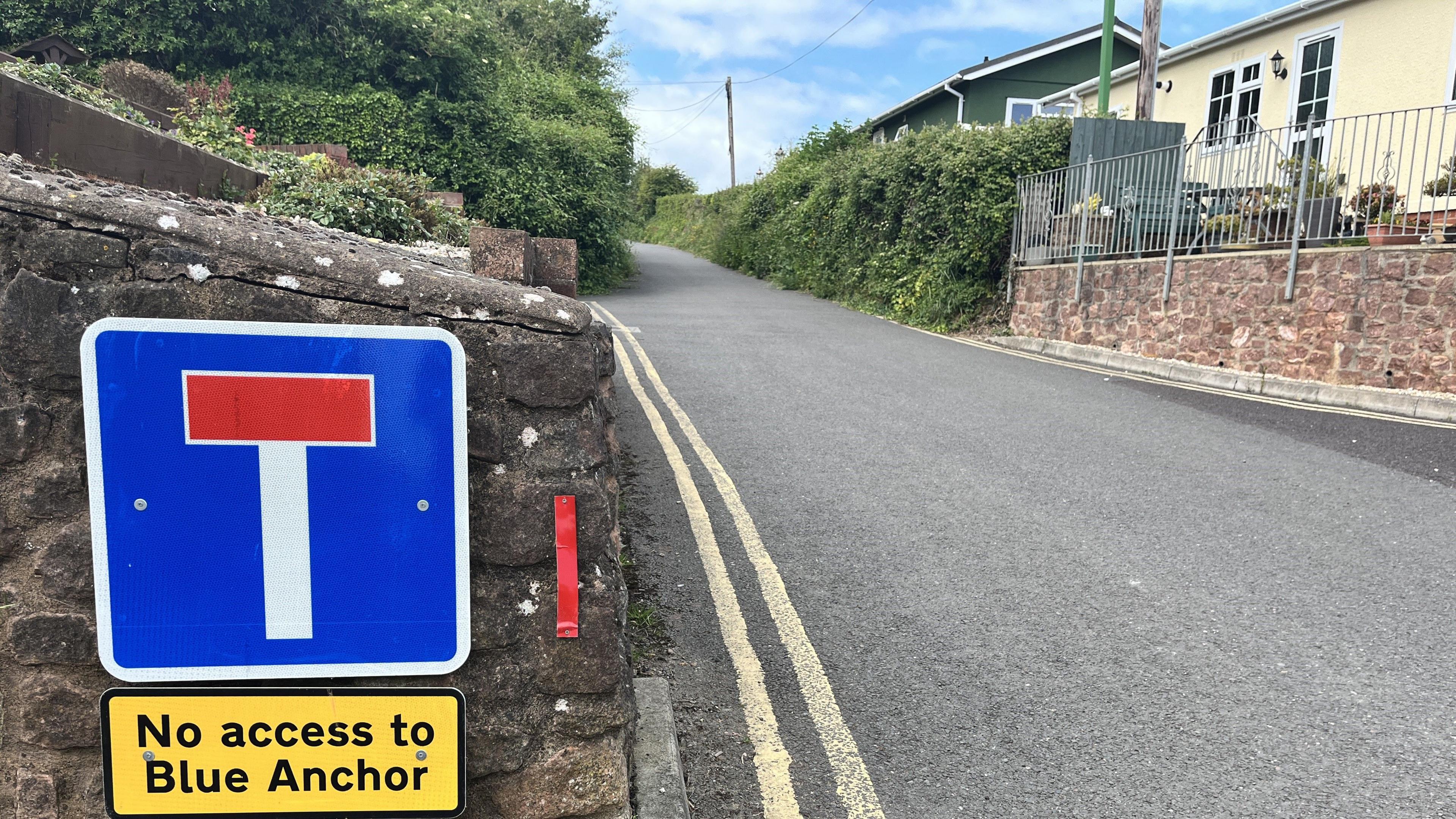 Road sign warning of no further access down a road