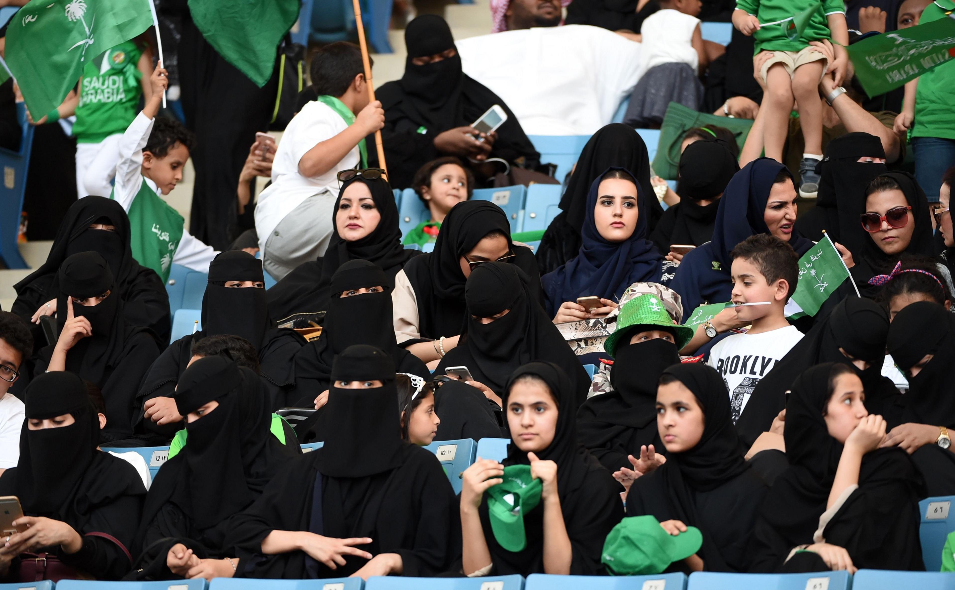 Saudi women sit in a stadium to attend an event in the capital Riyadh on 23 September 2017 commemorating the anniversary of the founding of the kingdom