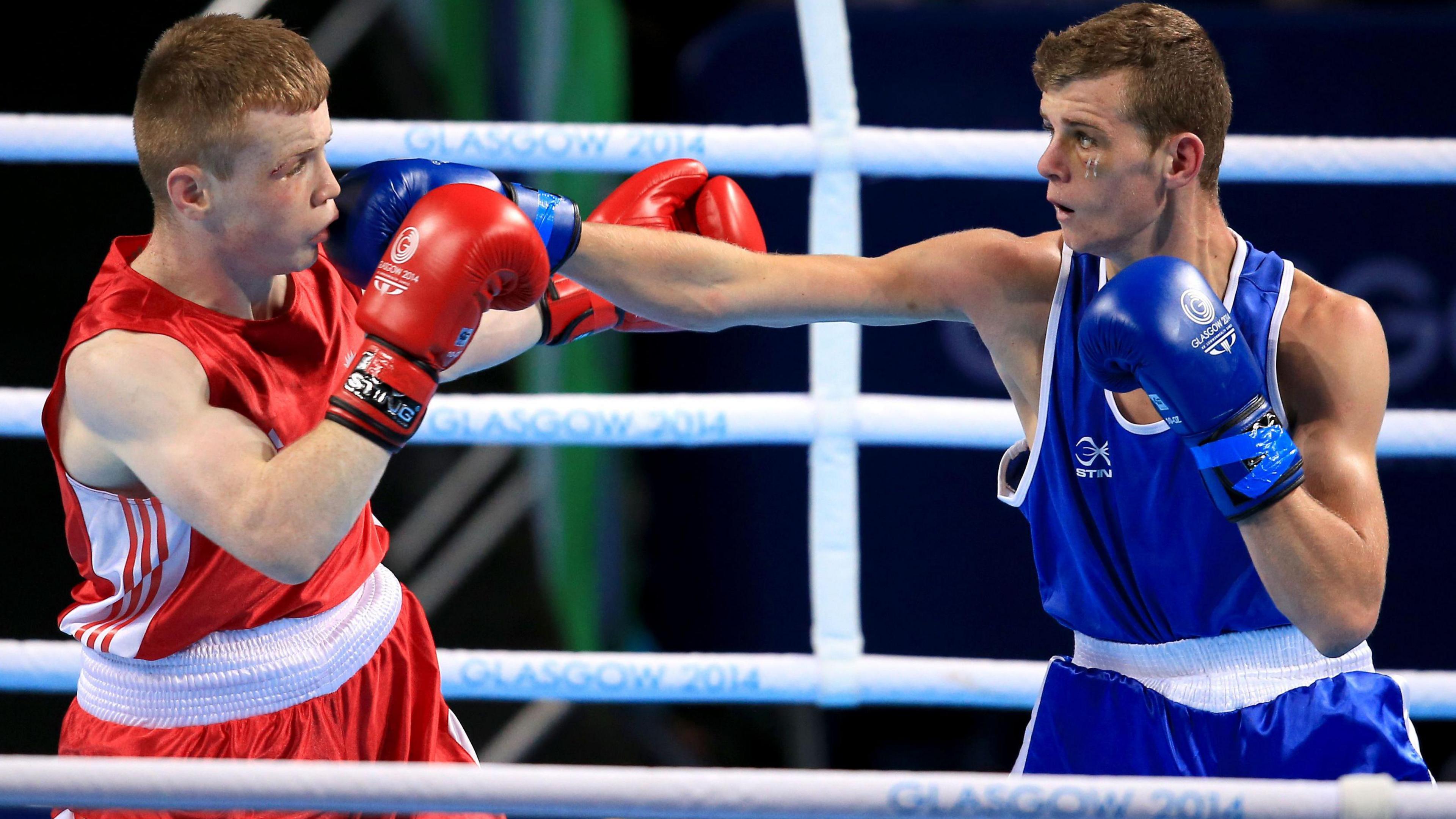 Scotland's Charlie Flynn (right) and Northern Ireland's Joe Fitzpatrick during the Men's Light (60kg) Final Bout at the SSE Hydro, during the 2014 Commonwealth Games in Glasgow.