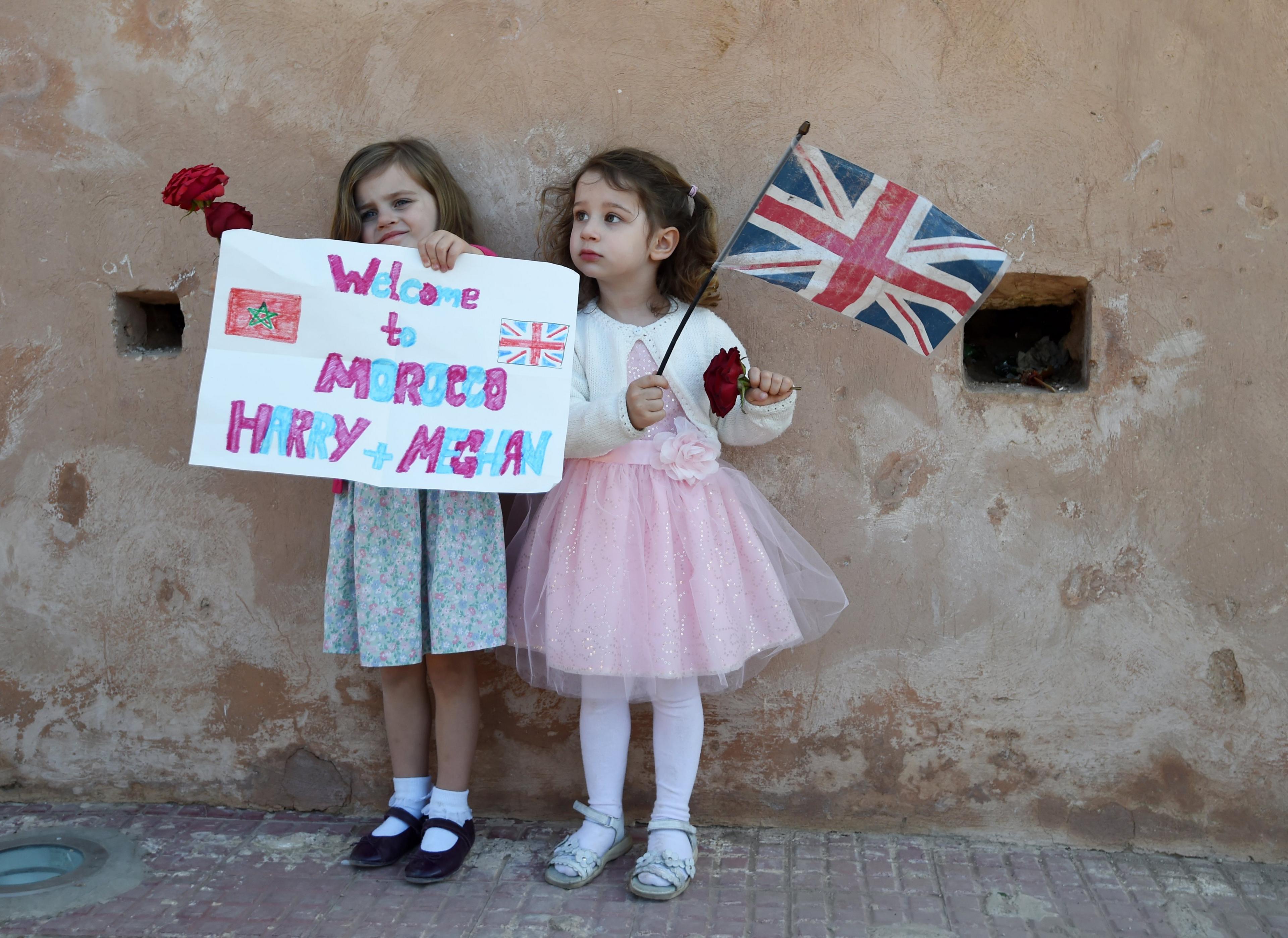 Two girls welcome Prince Harry and Meghan to Morocco