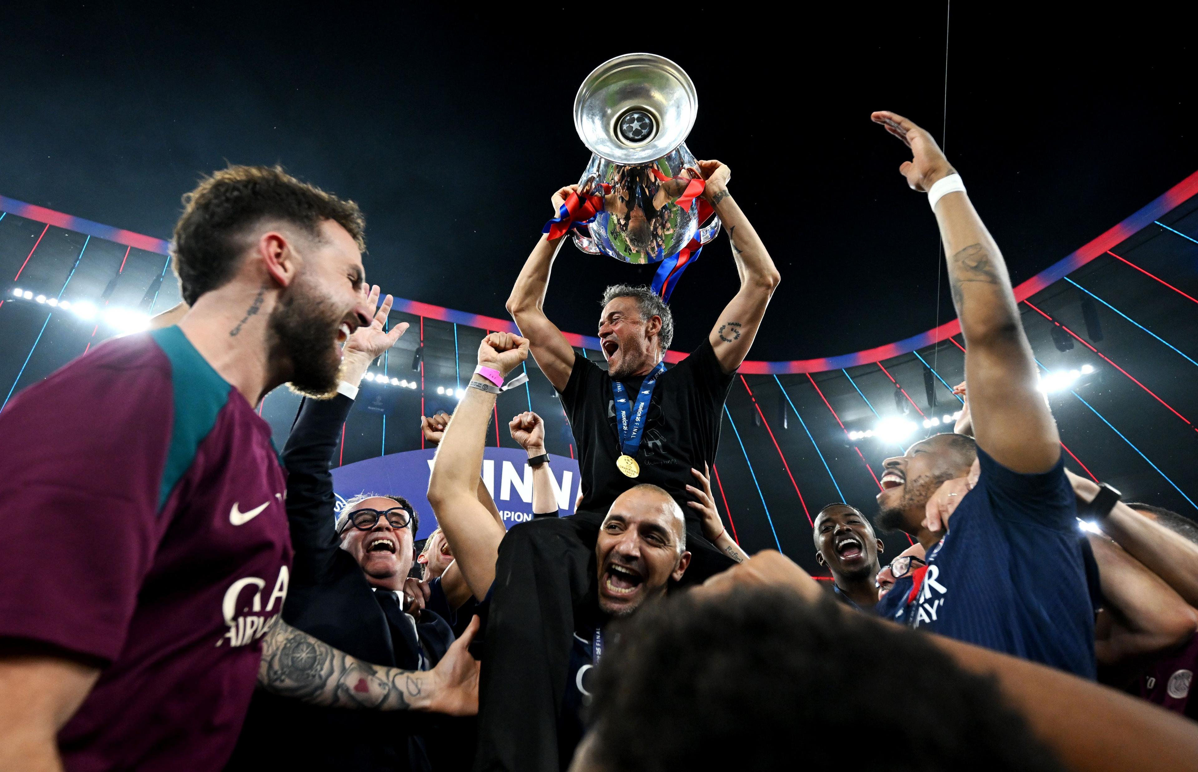 Head Coach of Paris Saint-Germain, Luis Enrique celebrates with the Champions League trophy after his team's victory, to secure Paris Saint-Germain's first ever UEFA Champions League title in the club's history and a record UEFA Champions League Final winning scoreline of 5-0. Photo by Michael Regan