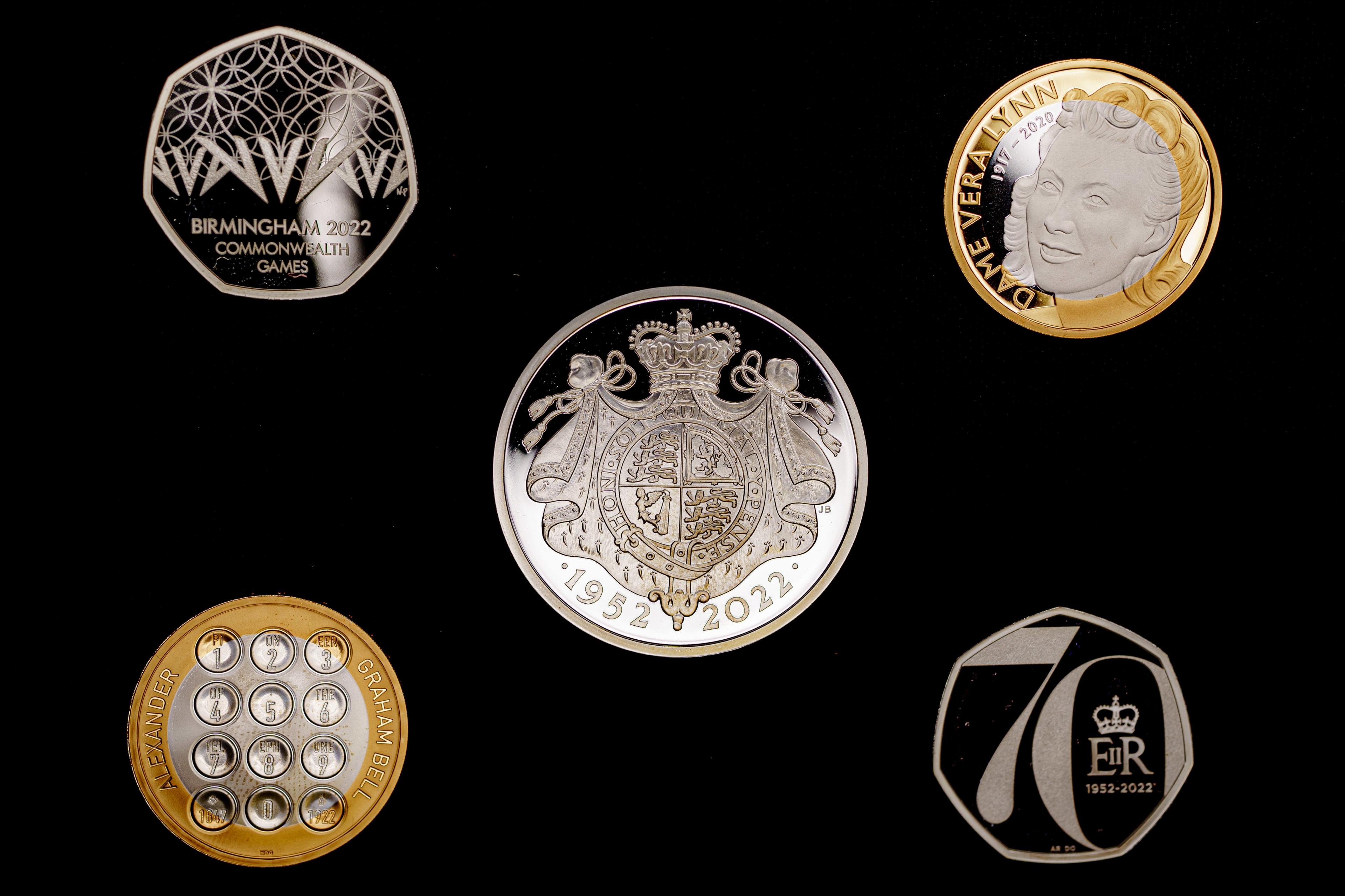 A Birmingham 2022 Commonwealth Games 50p coin (top left), a Life and Legacy of Dame Vera Lynn £2 coin (top right), a Platinum Jubilee of Her Majesty the Queen £5 coin (centre), a Life and Legacy of Alexander Graham Bell £2 coin (bottom left) and a Platinum Jubilee of Her Majesty the Queen 50p coin (bottom right),