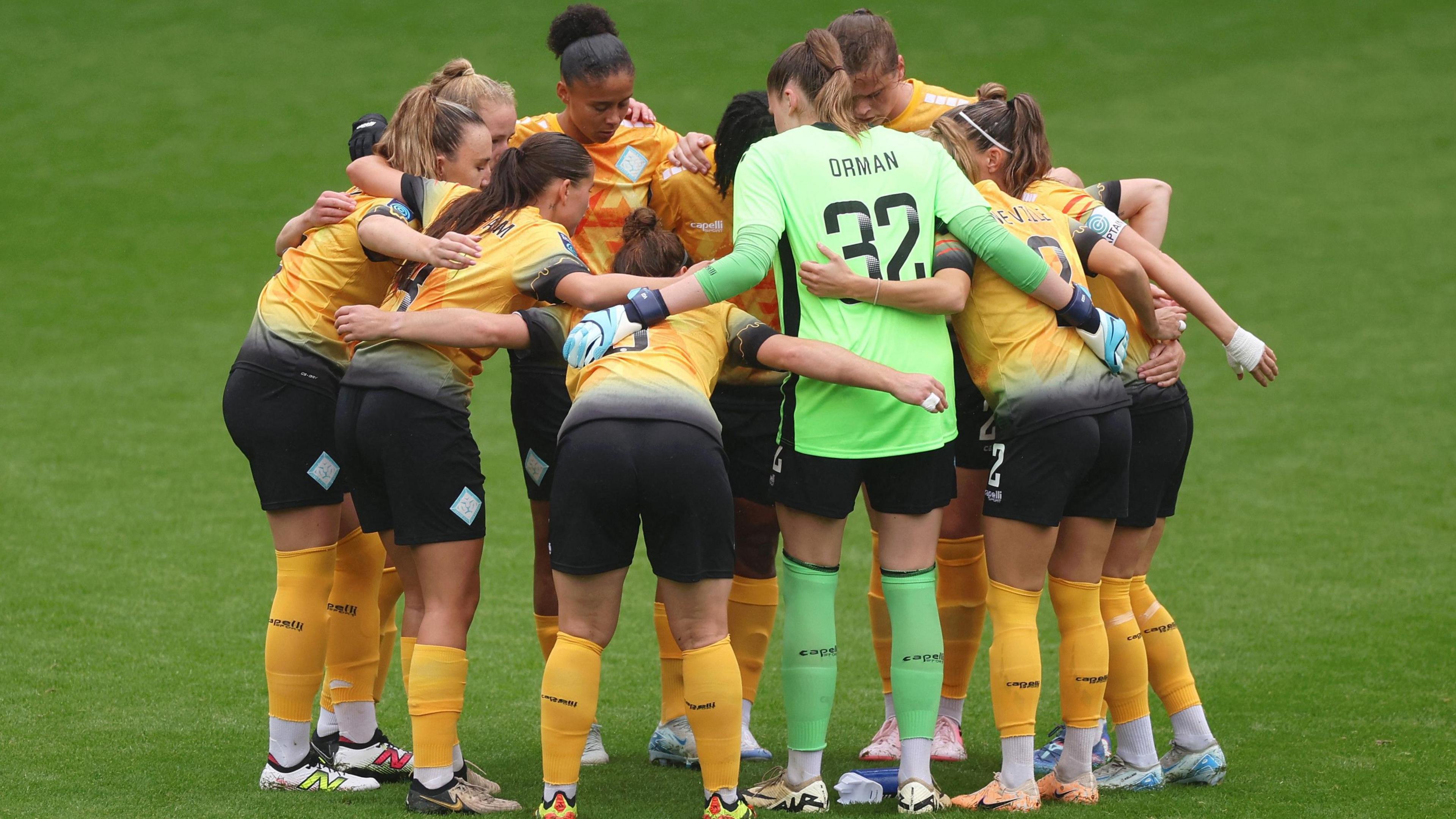 London City Lionesses huddle