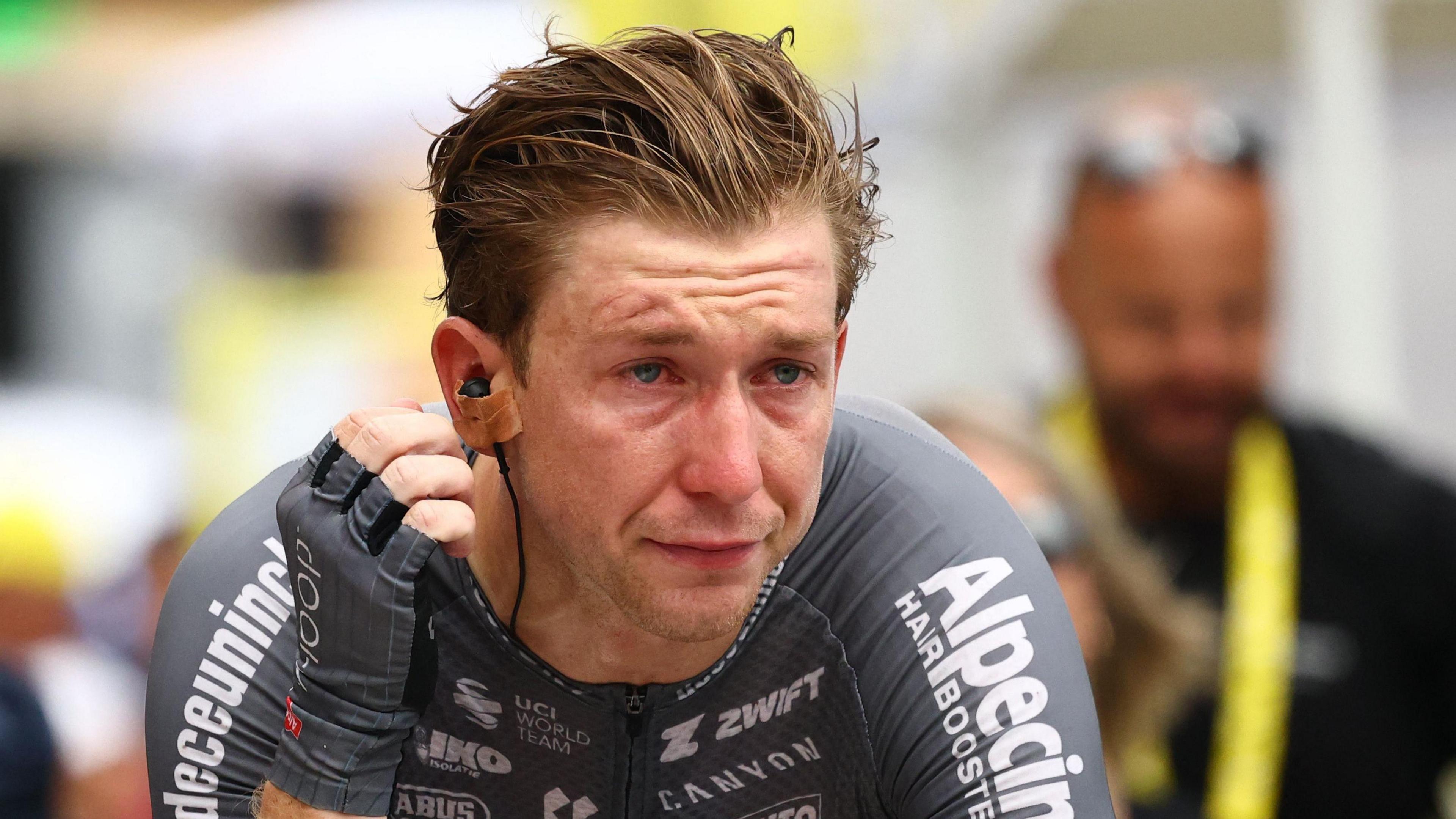 Kaden Groves looking emotional after winning stage 20 of the Tour de France