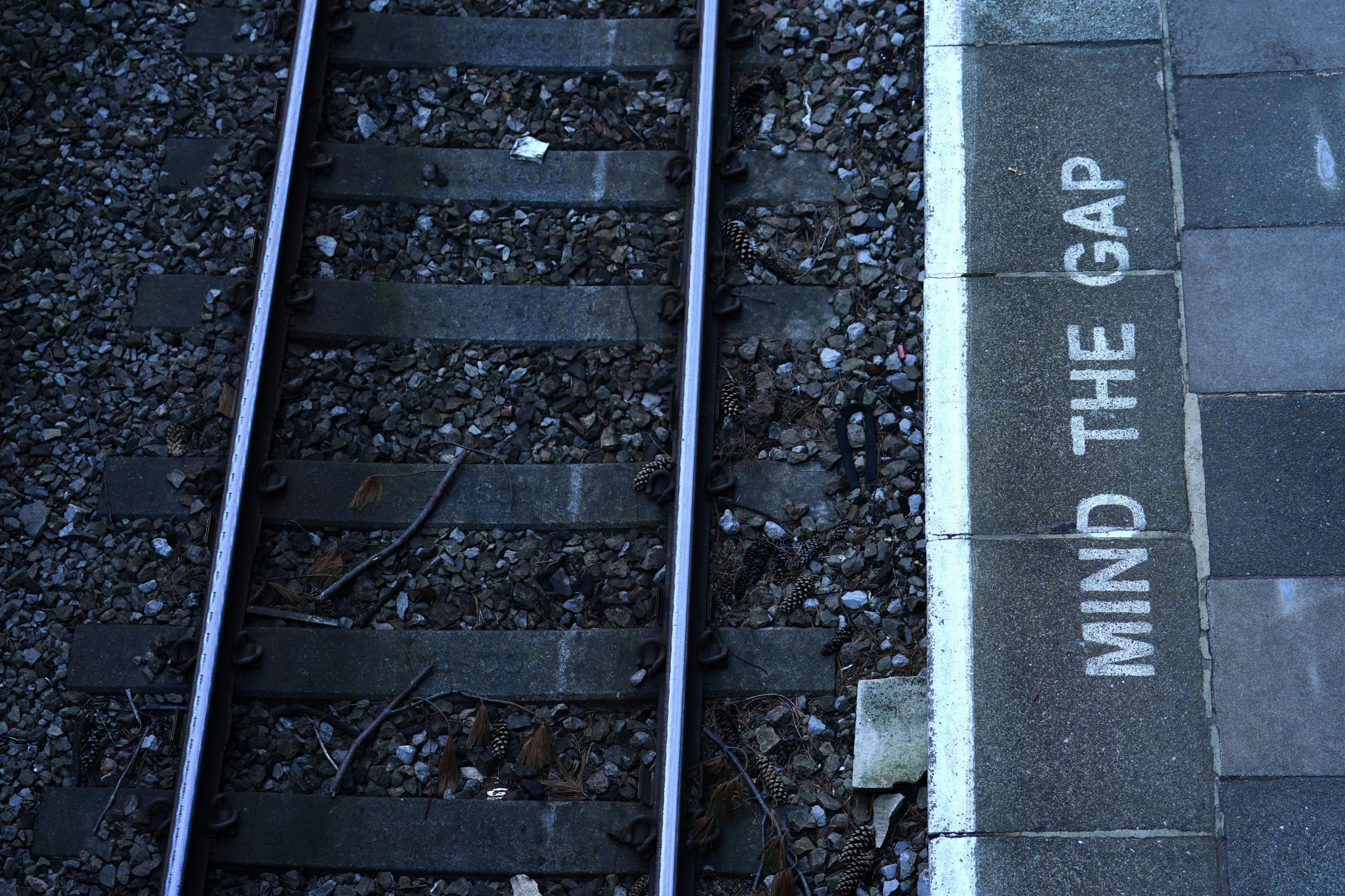 A "mind the gap" sign on a platform