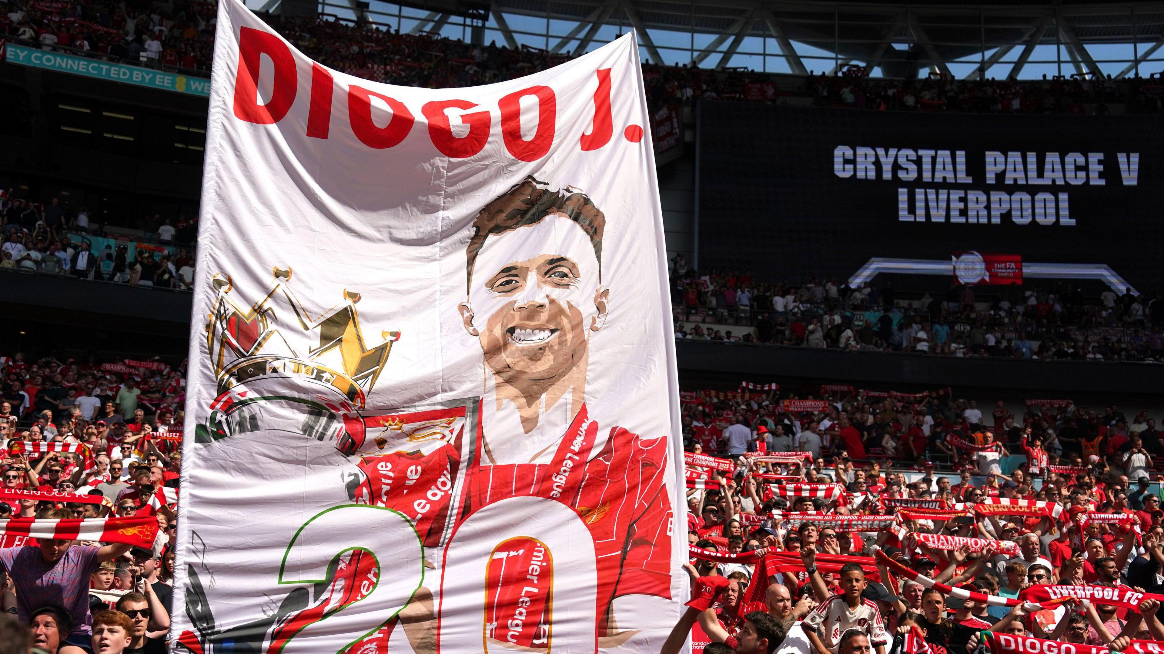 Liverpool fans holding up a banner in tribute to Diogo Jota during their Community Shield match against Crystal Palace.