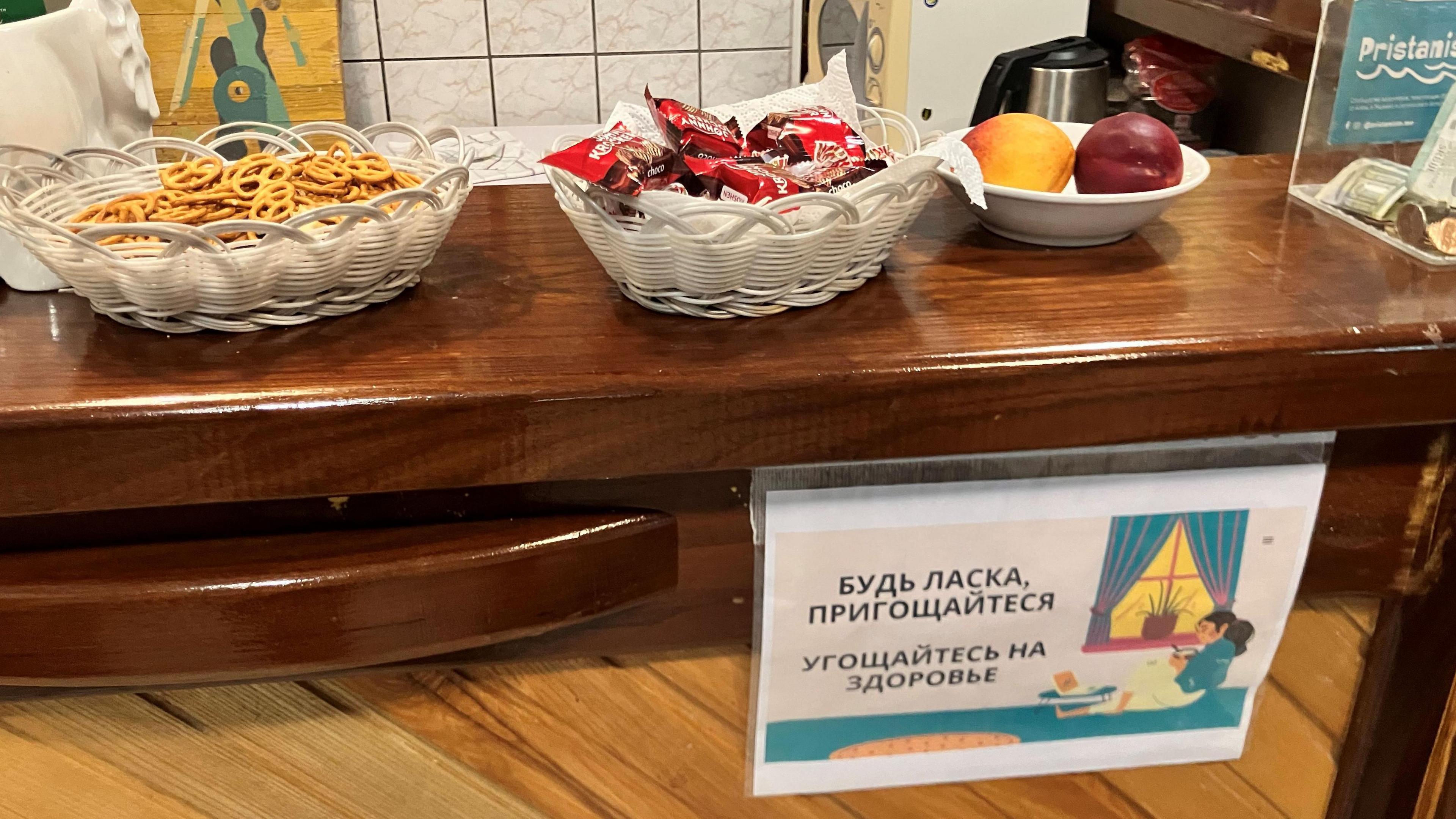 A sign in Ukrainian and Russian at Pristaniste's cafe invites residents to help themselves to snacks