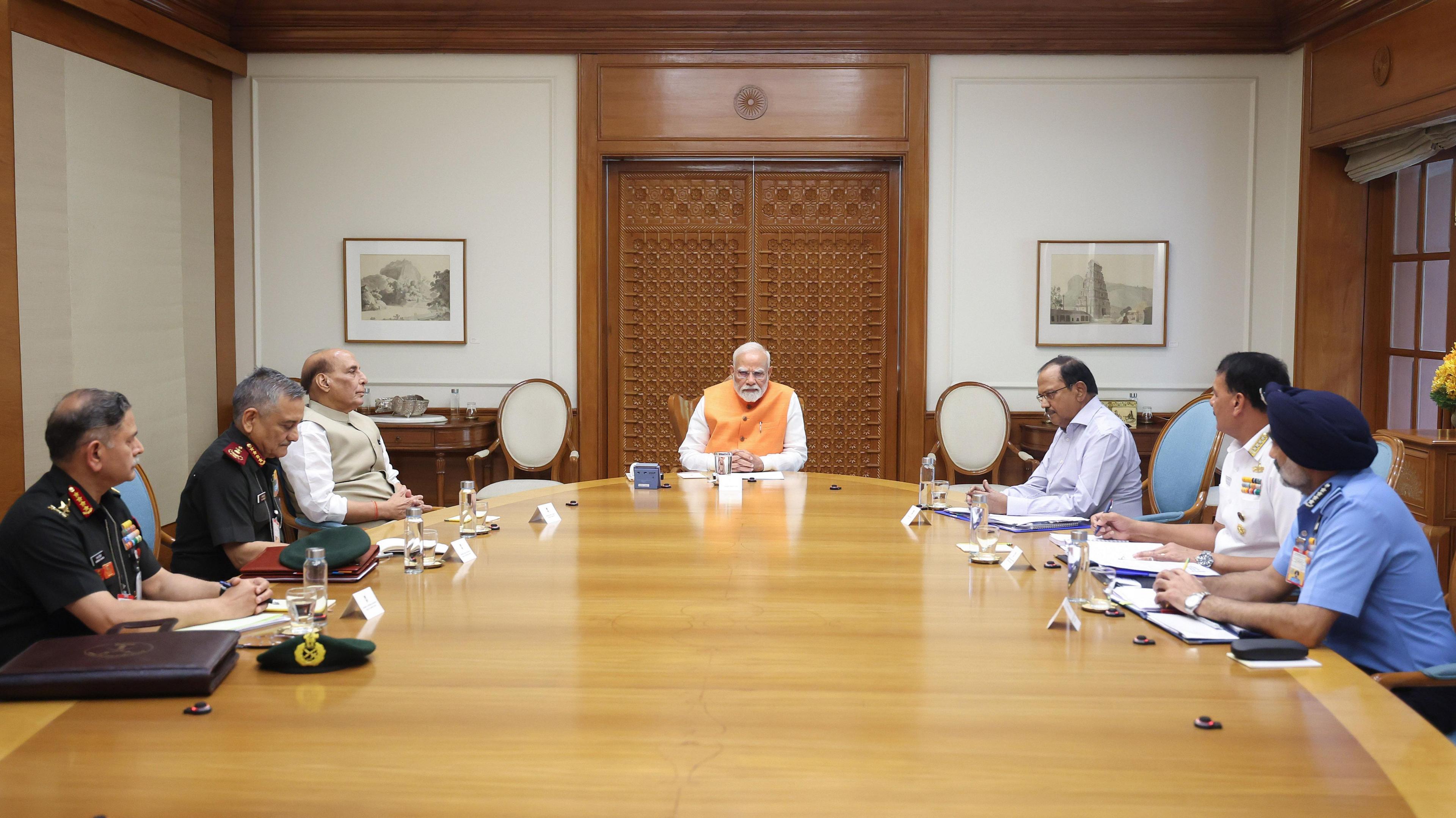 A handout photo made available by the Press Information Bureau (PIB) shows Indian Prime Minister Narendra Modi (C), Indian Defence Minister Rajnath Singh (3L), National Security advisor Ajit Doval (3R), Chief of Defence Staff Gen. Anil Chauhan (2L), Navy Chief Adm. Dinesh K. Tripathi (2R), Air Force Chief Air Chief Marshal Amar Preet Singh (R) and Army Chief Gen. Upendra Dwivedi (L) during a meeting in New Delhi, India, 29 April 2025.