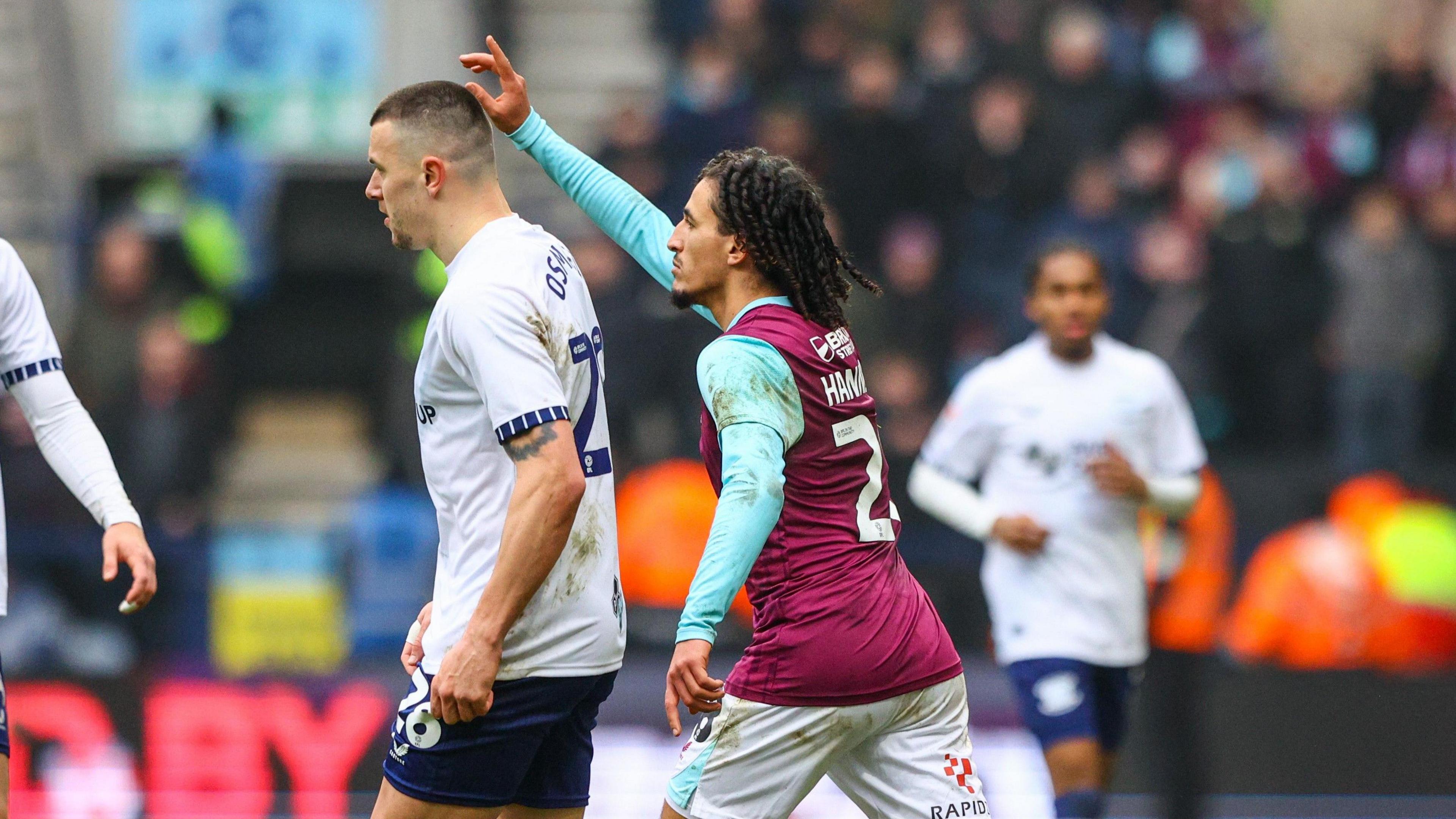 Hannibal goes to approach the referee during the game with Preston