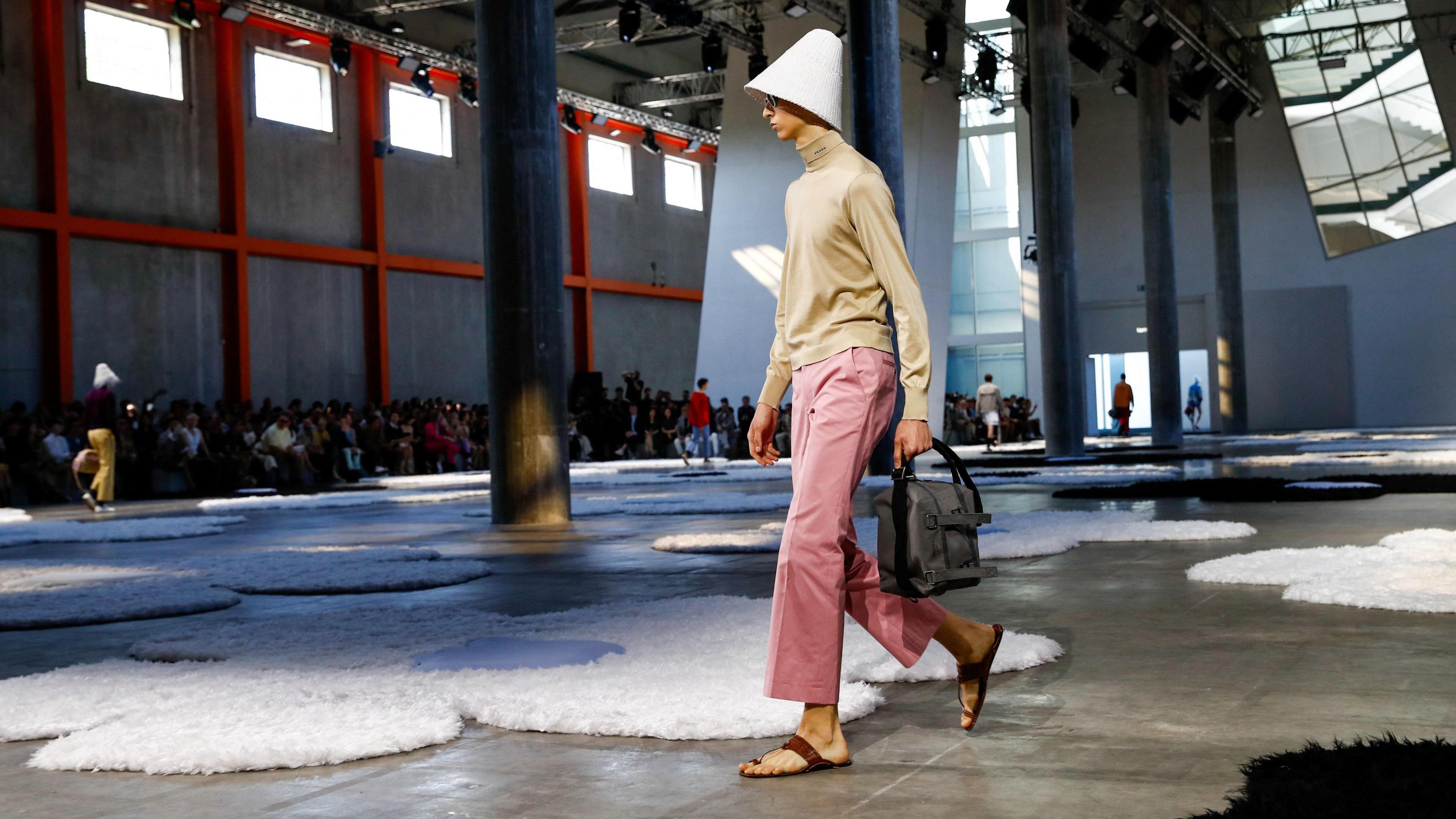 A model presents a creation from the Prada Spring-Summer 2026 menswear collection during the Milan Fashion Week in Milan, Italy, June 22, 2025