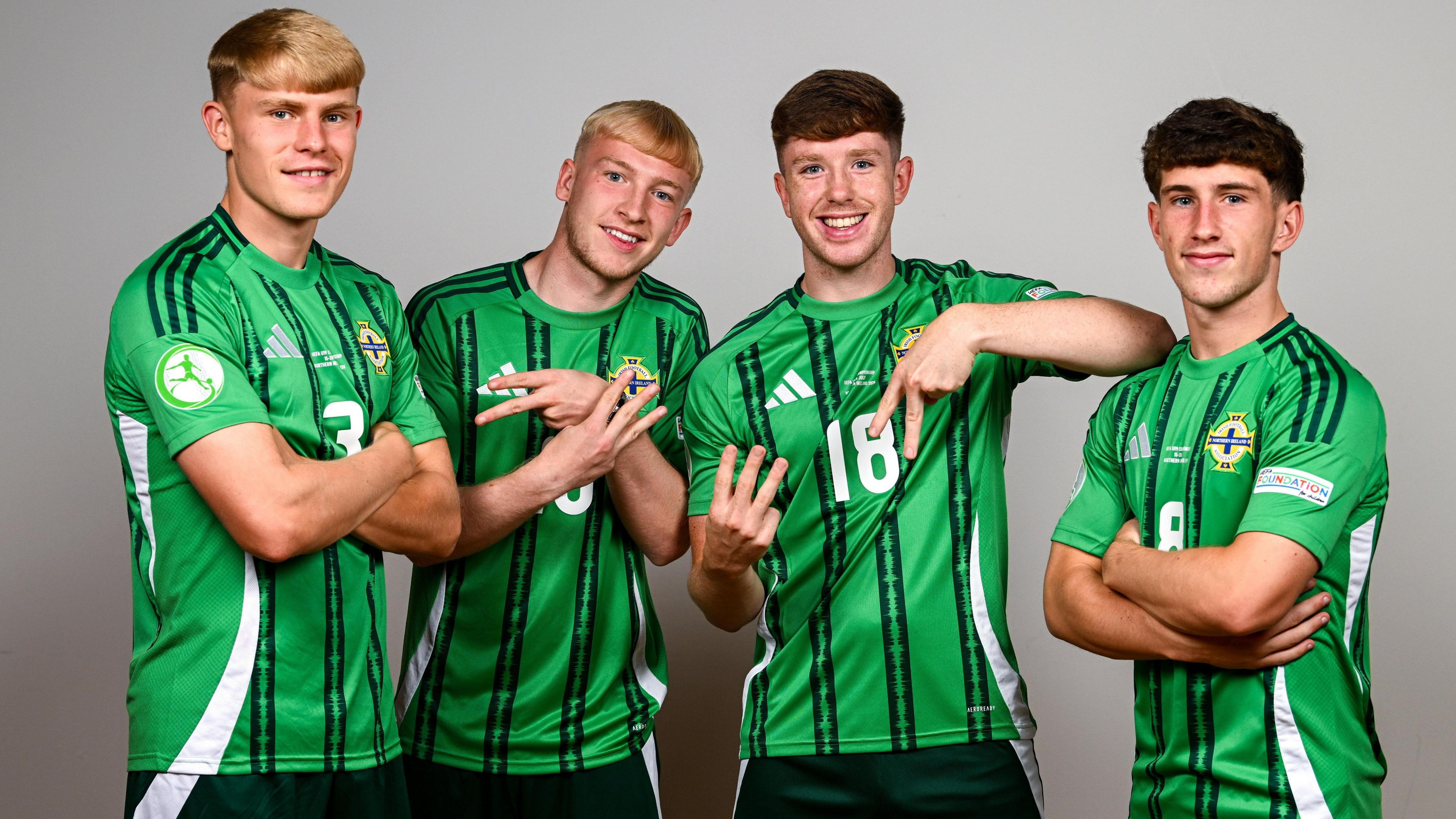 The Uefa European Under-19 NI players in green football tops 