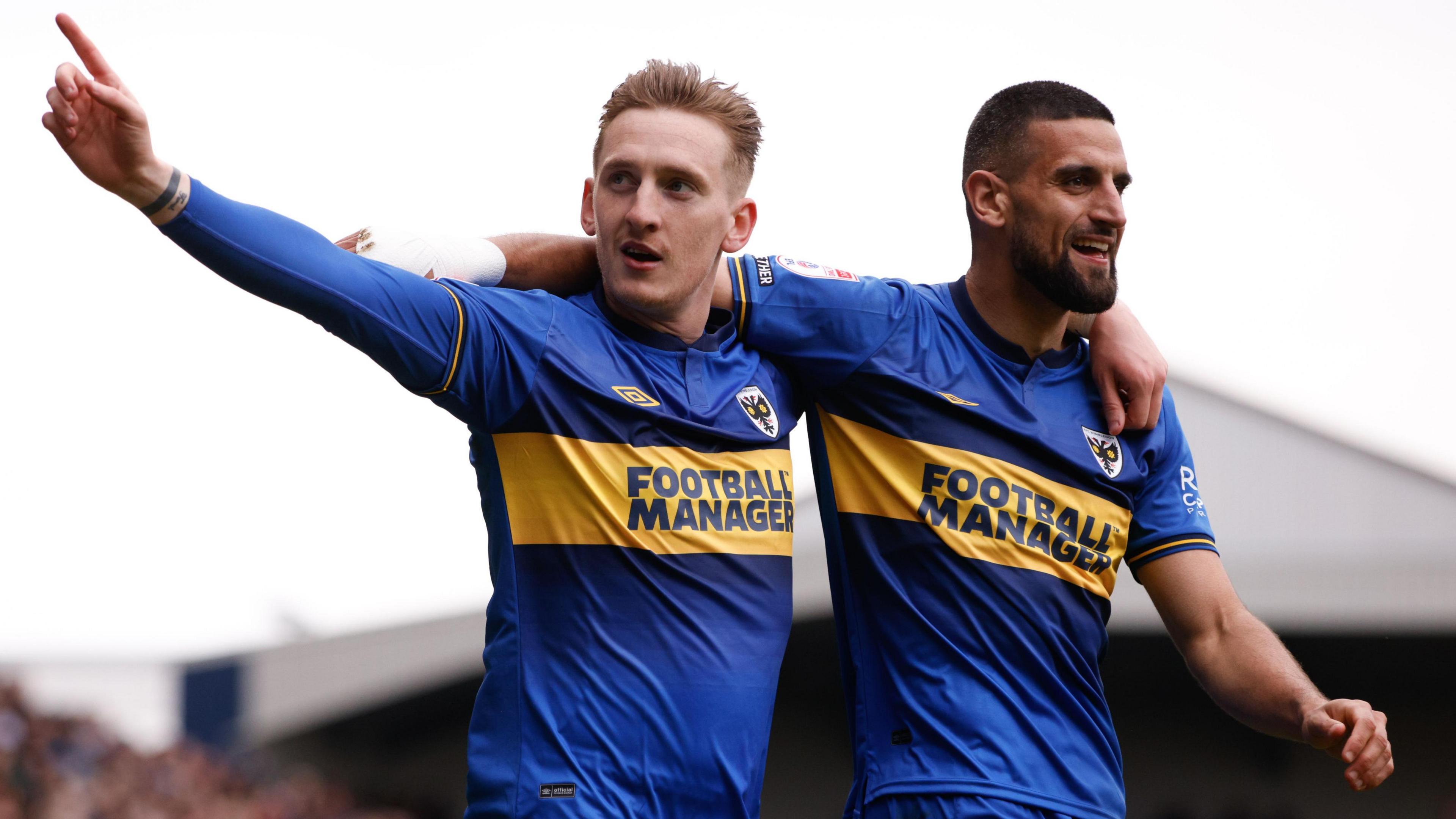 Ronan Curtis celebrates a goal for AFC Wimbledon