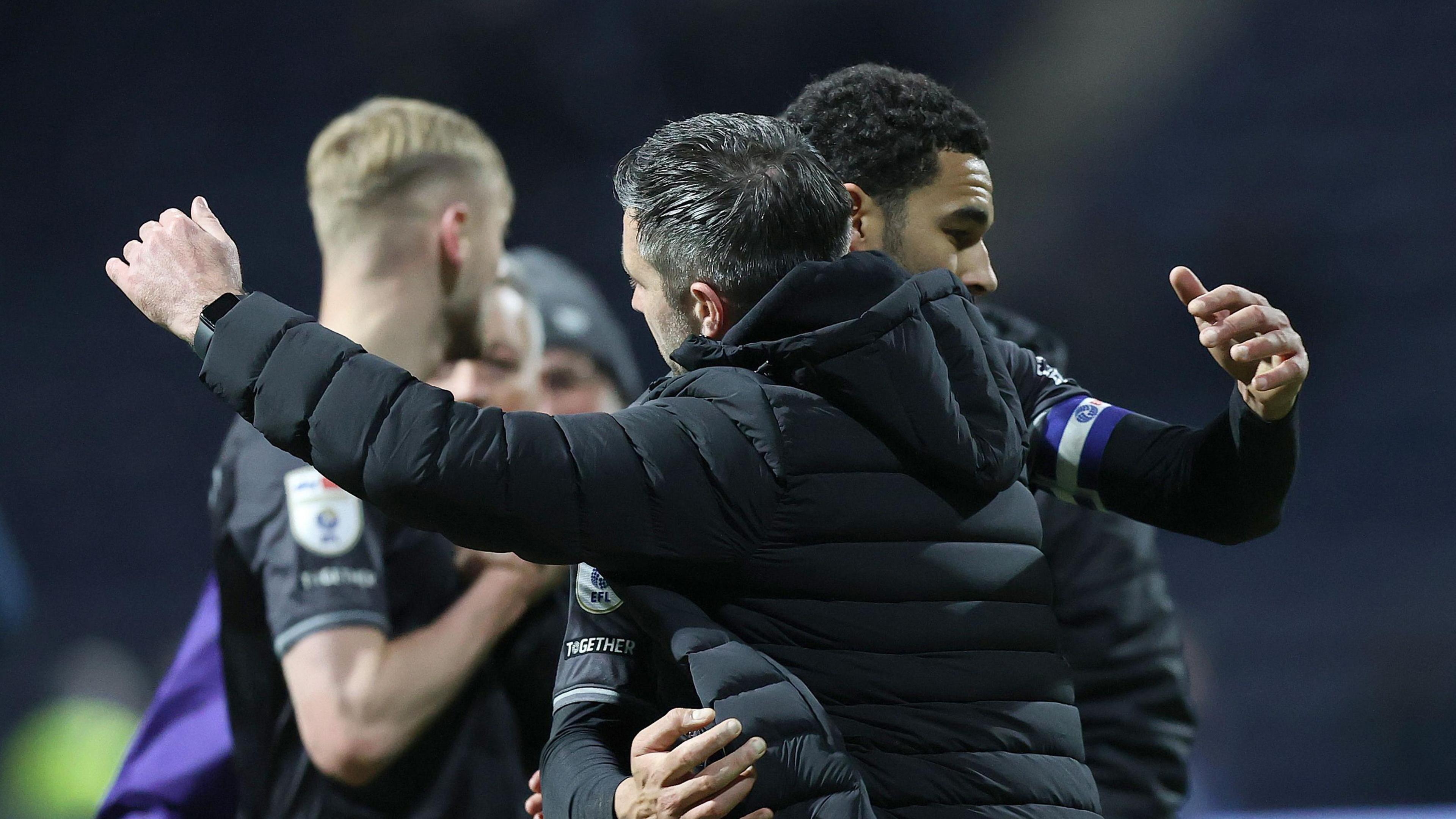 Alan Sheehan embraces Ben Cabango after Swansea's draw at Preston