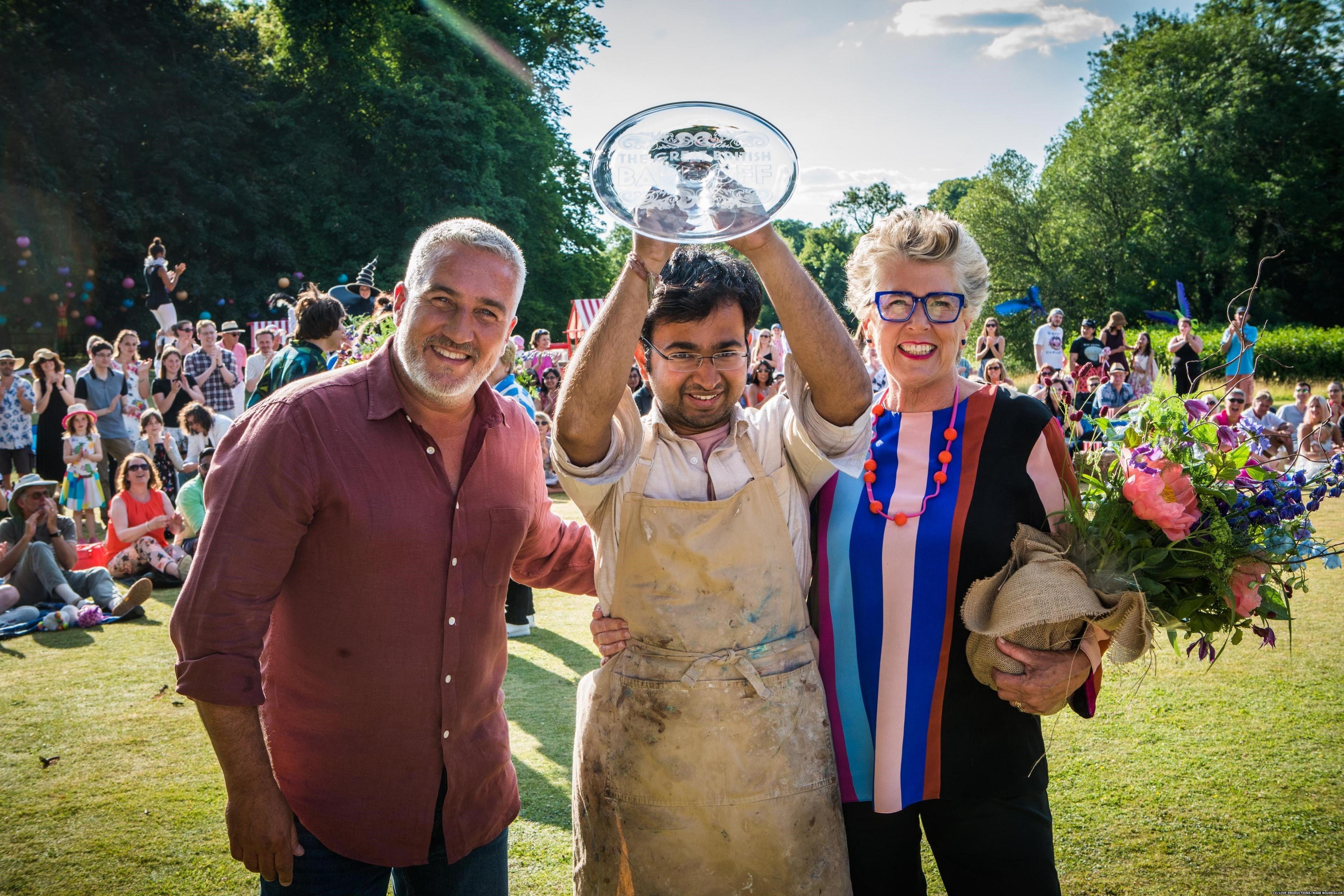 Rahul Mandal (centre) is crowned champion by judges Paul Hollywood (left) and Prue Leith (right)