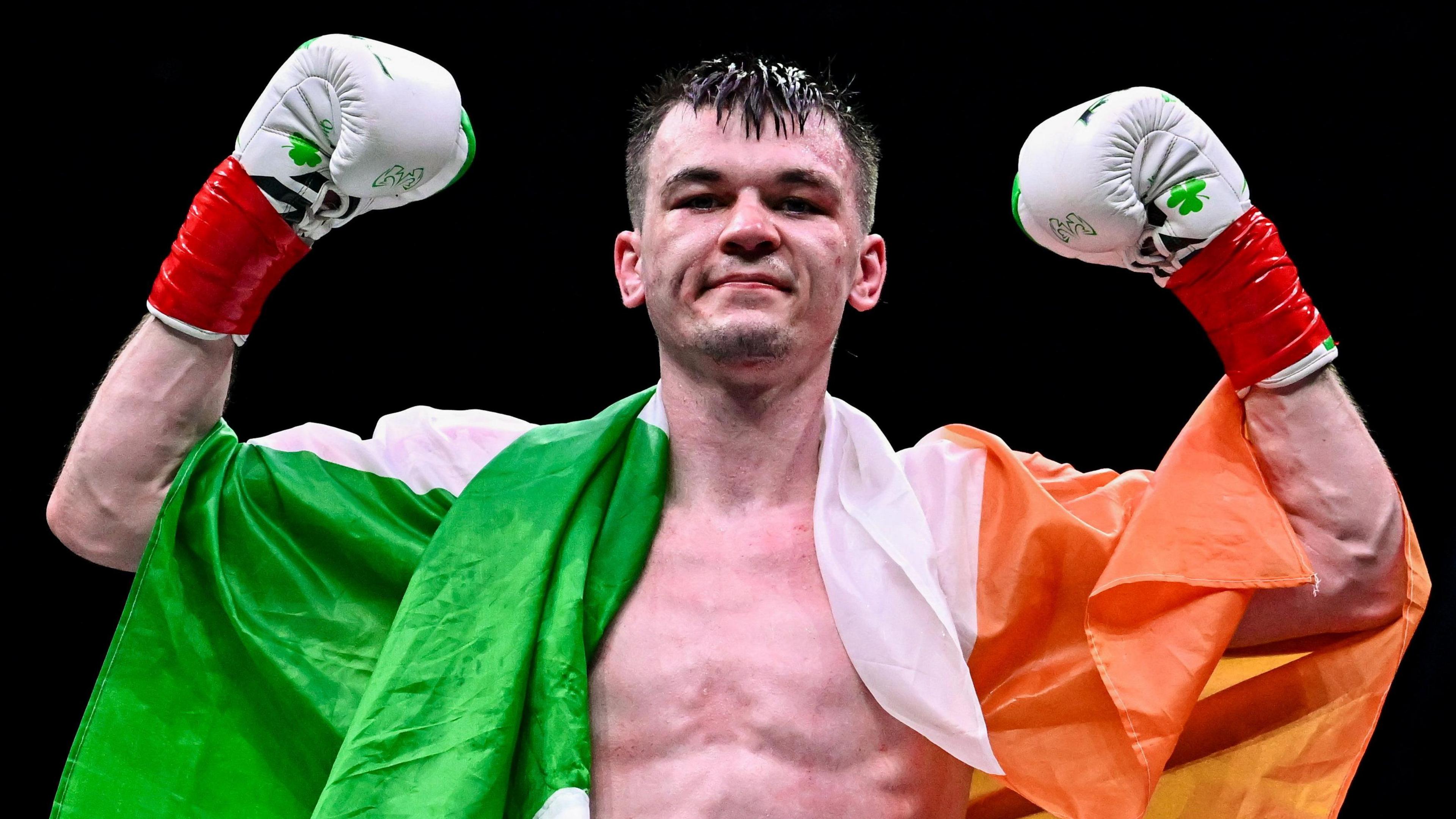Aaron McKenna celebrates winning the IBF middleweight title
