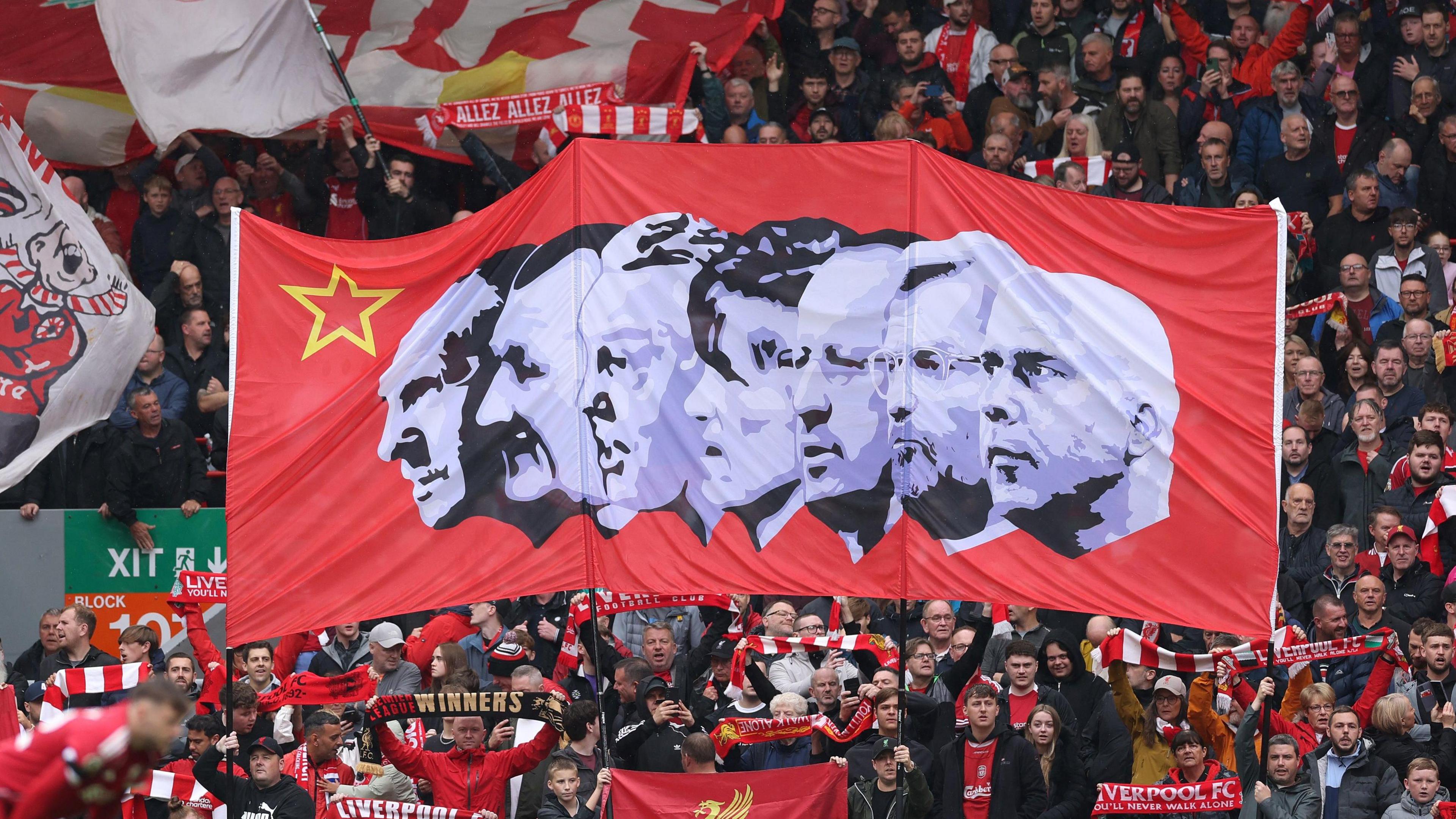 A banner showing Bill Shankly, Bob Paisley, Joe Fagan, Kenny Dalglish, Rafael Benitez, Jurgen Klopp and Arne Slot
