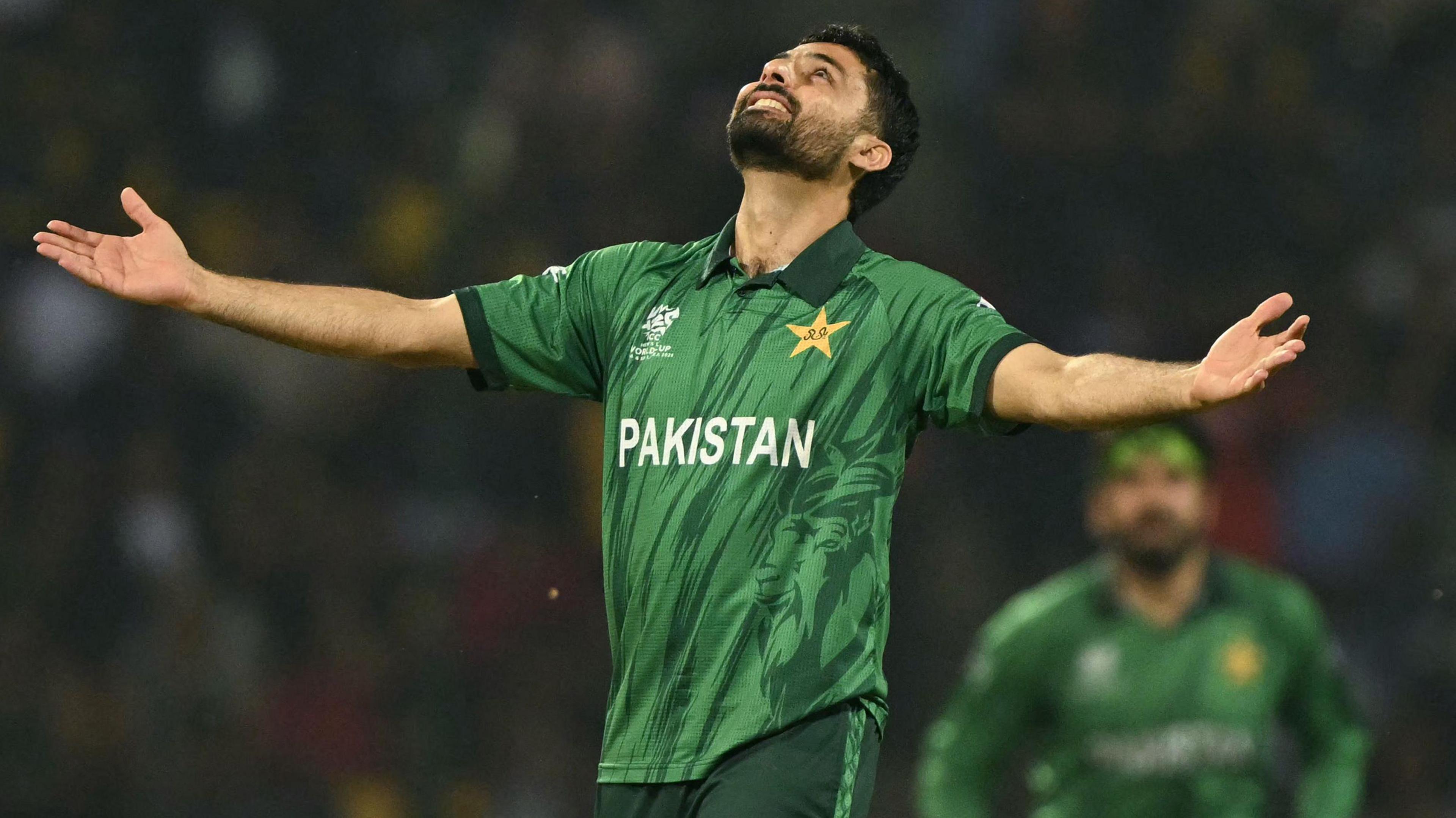 Abrar Ahmed looks up to the sky as he celebrates taking a wicket