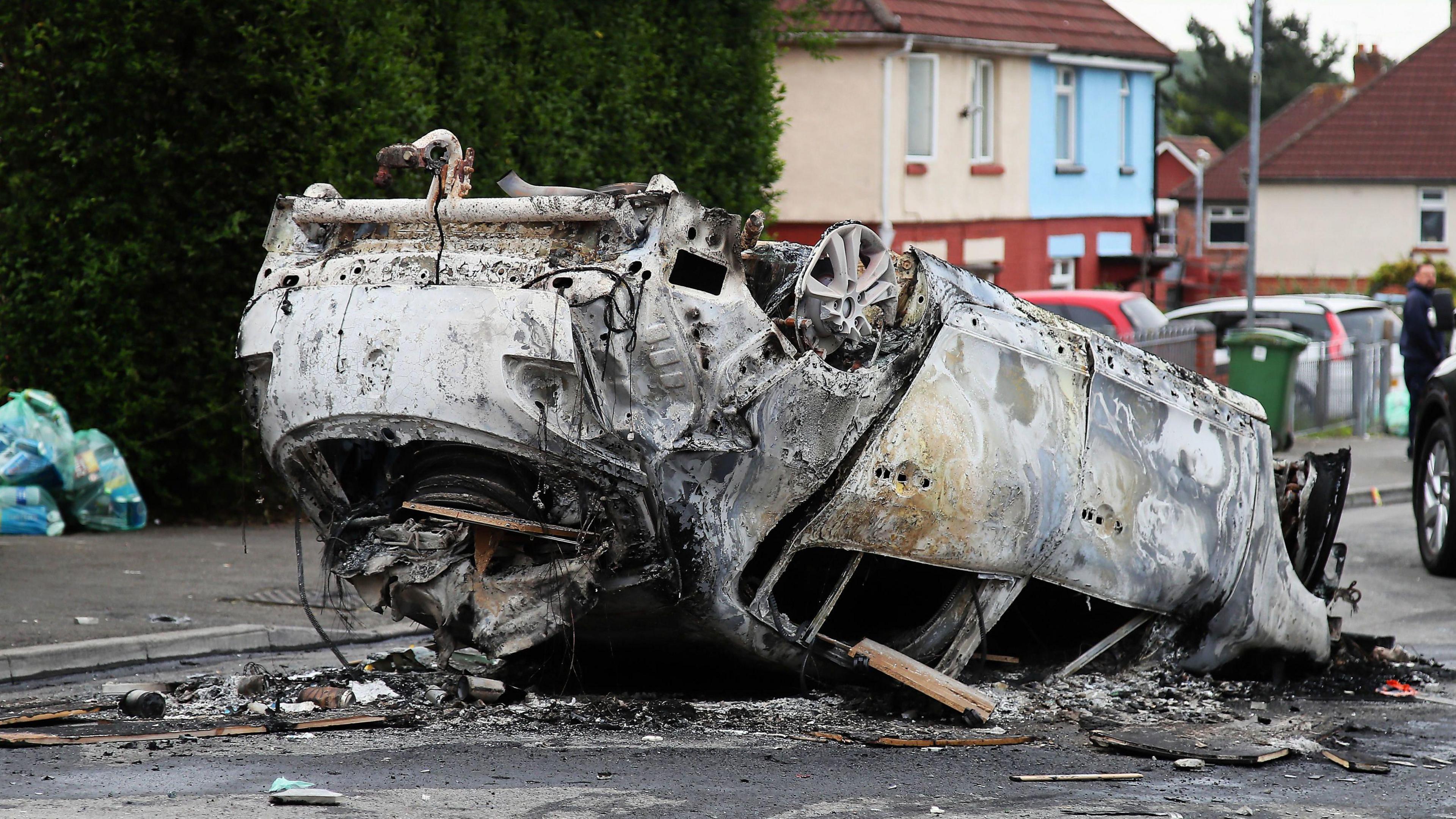  Car that was set alight in Ely, Cardiff, following the riot 