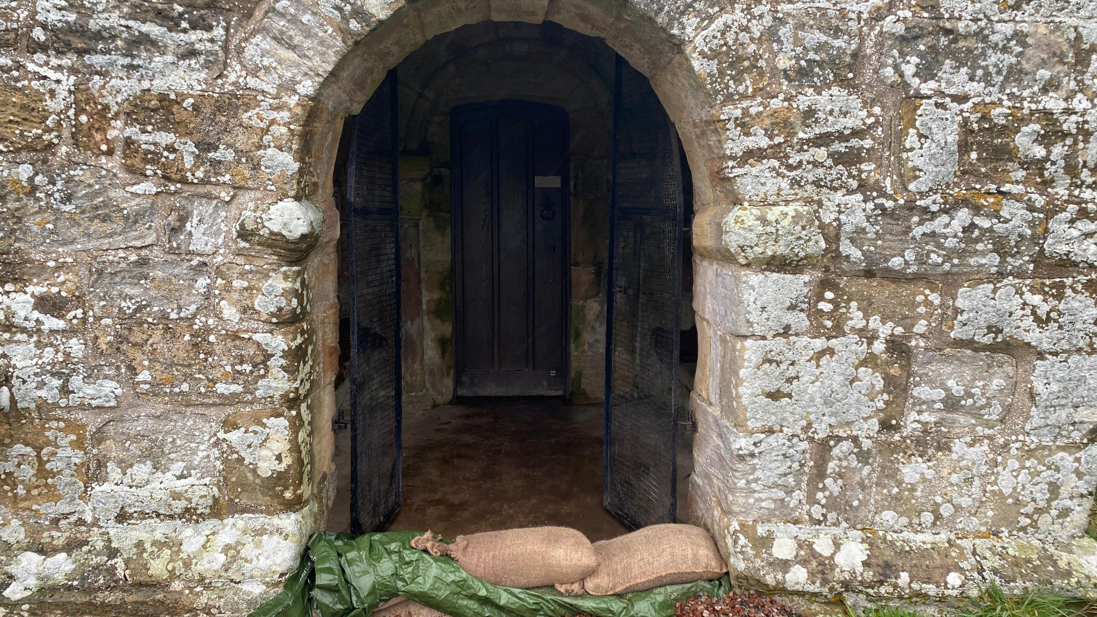 Sandbags at the door of the church