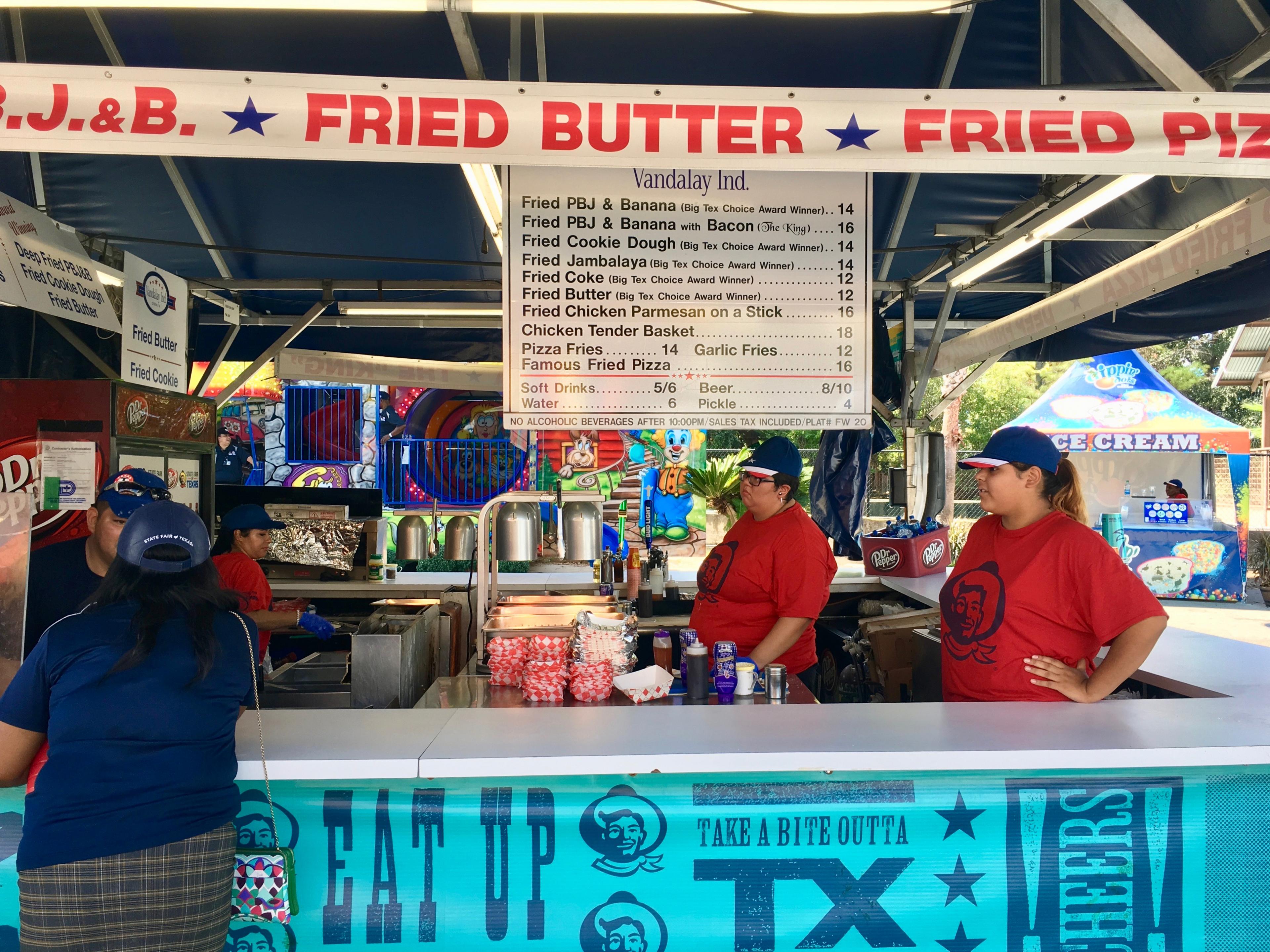 A stand full of deep-fried food on the menu