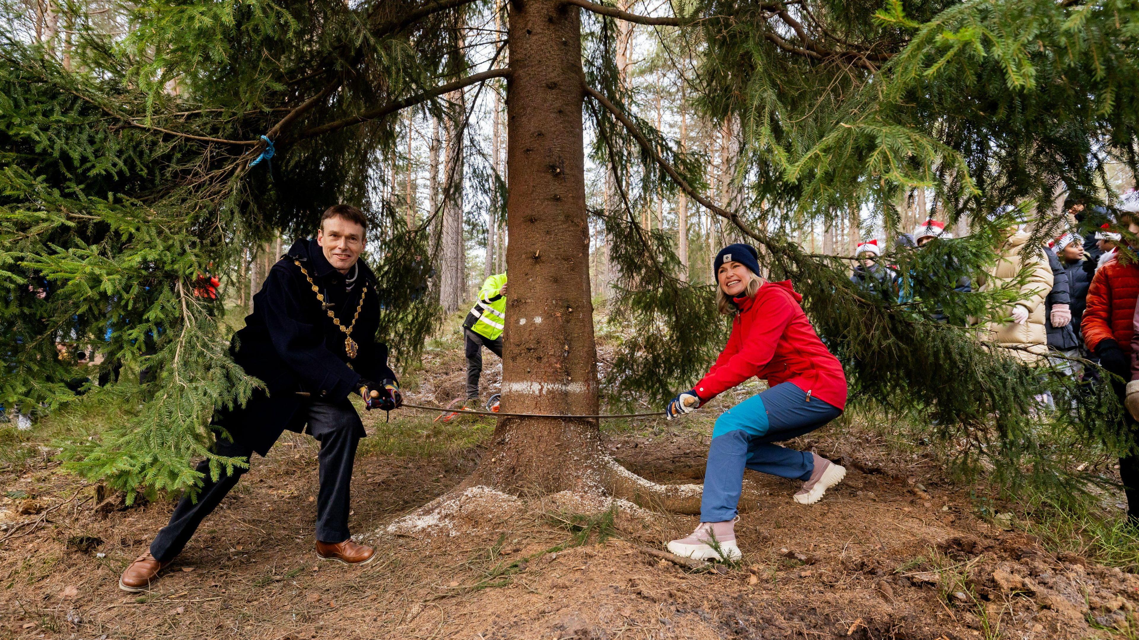 The Lord Mayor of Westminster and the Mayor of Oslo doing the tree cutting ceremony