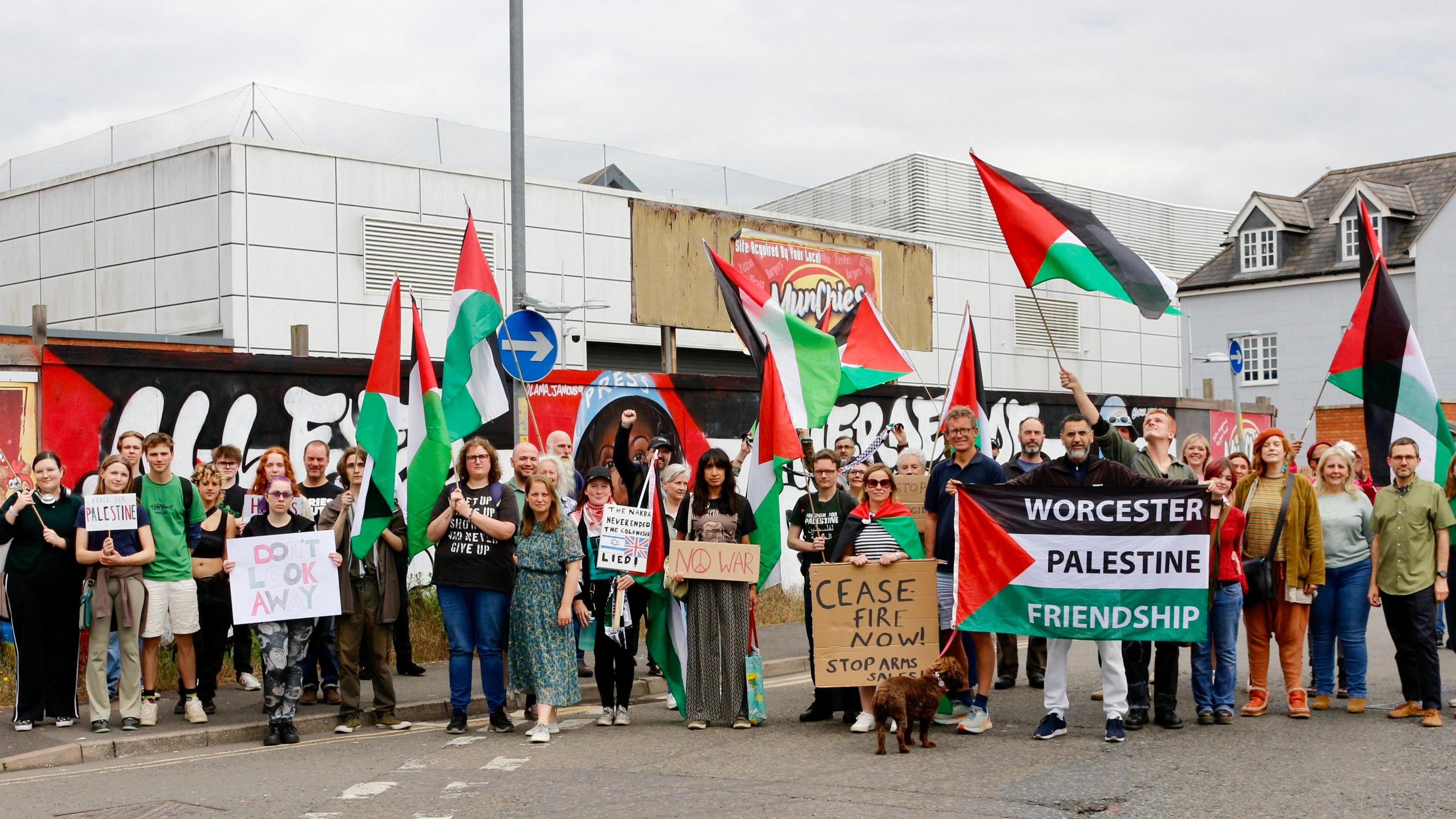 Campaigners with the mural