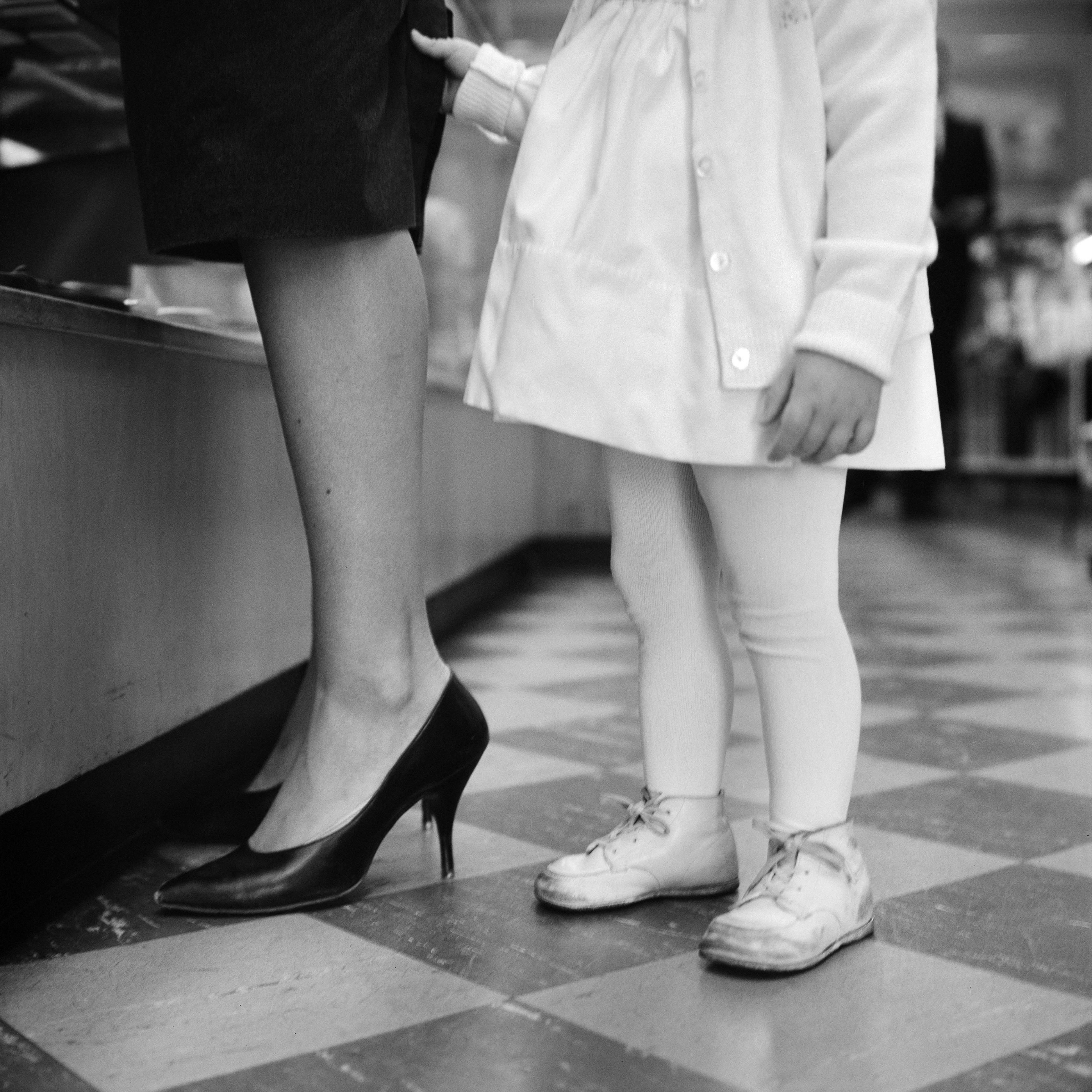 Photo of child and woman taken by Vivian Maier on 18 September 1962