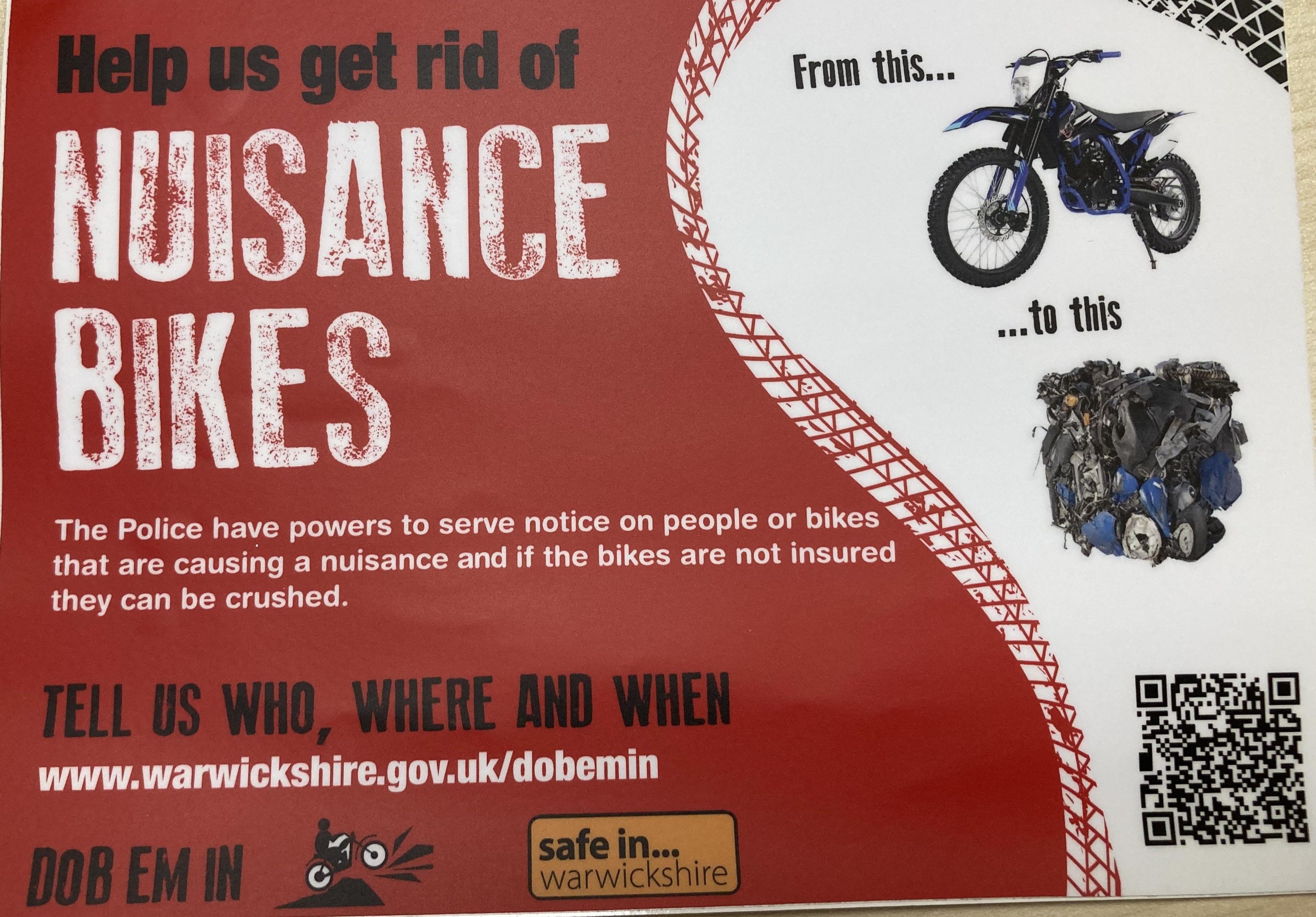 A police poster advertising the Dob Em In reporting tool. The poster in red and white features an image of a motorbike, a motorbike crushed into a cube of scrap metal, and the heading Help us get rid of nuisance bikes